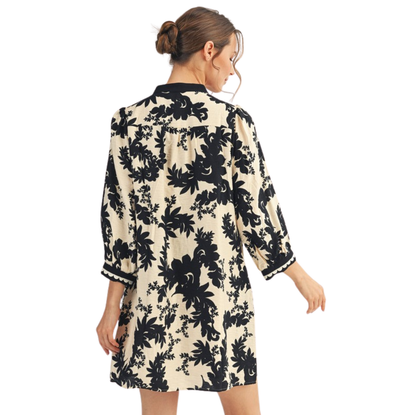 This black mini dress from Jodifl features a delicate floral print and elegant lace trim that enhances its refined style. The 3/4 length sleeves offer a balanced coverage, making it perfect for both day and evening occasions. Its shift silhouette provides a comfortable yet flattering fit, combining classic design with subtle detailing for a versatile wardrobe staple.