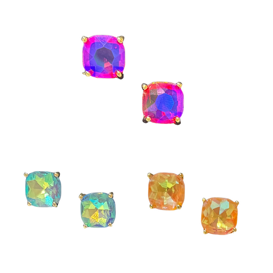 Upgrade your earring collection with our Colored Rhinestone Earrings by Tell Your Tale! These stud earrings feature large, iridescent rhinestones in pink, blue, clear, and fuchsia. Elevate any outfit with a touch of sparkle.