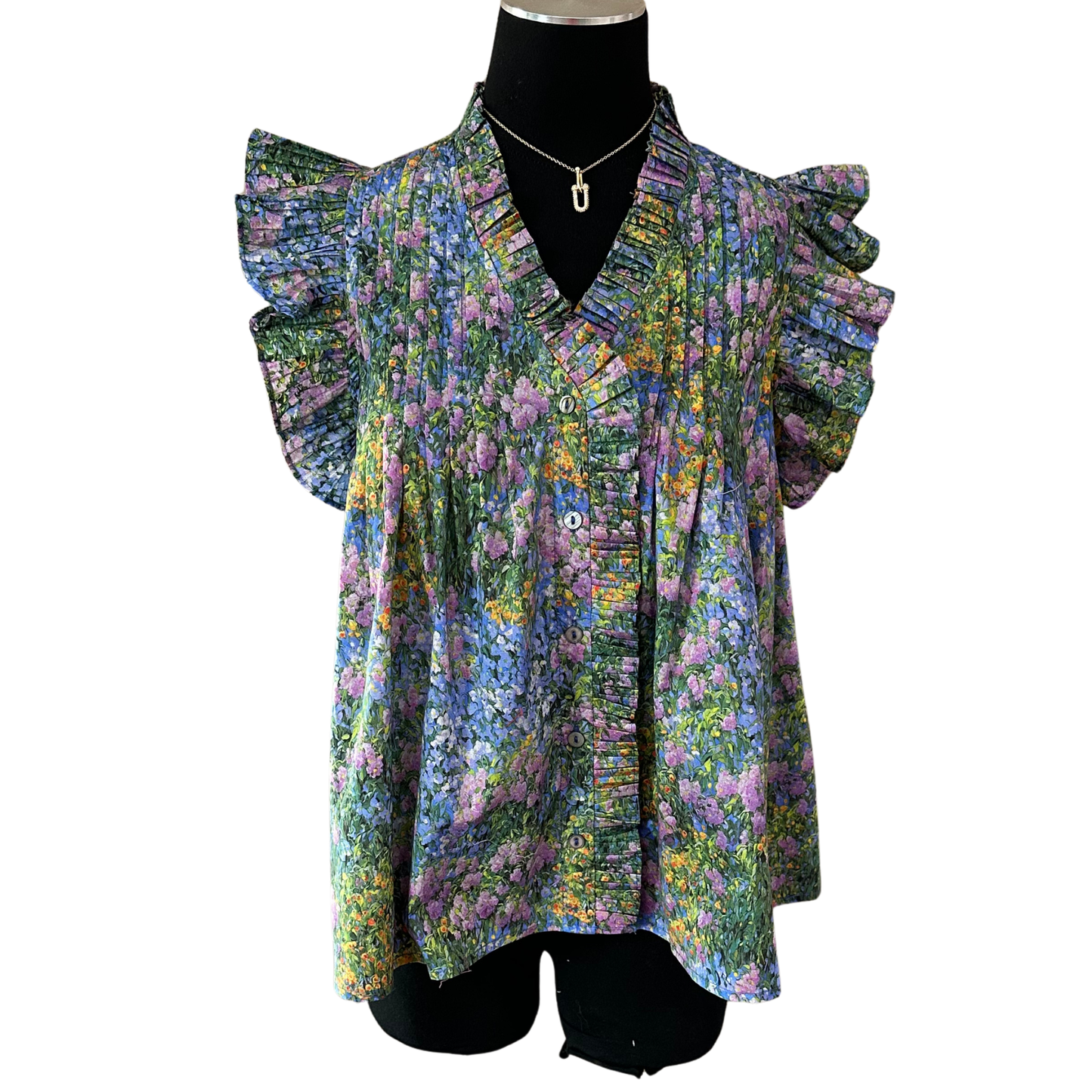 Elevate your wardrobe with this charming Floral Button Down Top by Entro. Featuring a vibrant floral print, crisp collar, and convenient short sleeves, this piece effortlessly transitions from casual outings to relaxed workdays. The classic button-down silhouette offers timeless style with a contemporary twist. Perfect for layering or wearing solo, this versatile top pairs beautifully with jeans, skirts, or tailored trousers for endless styling possibilities.