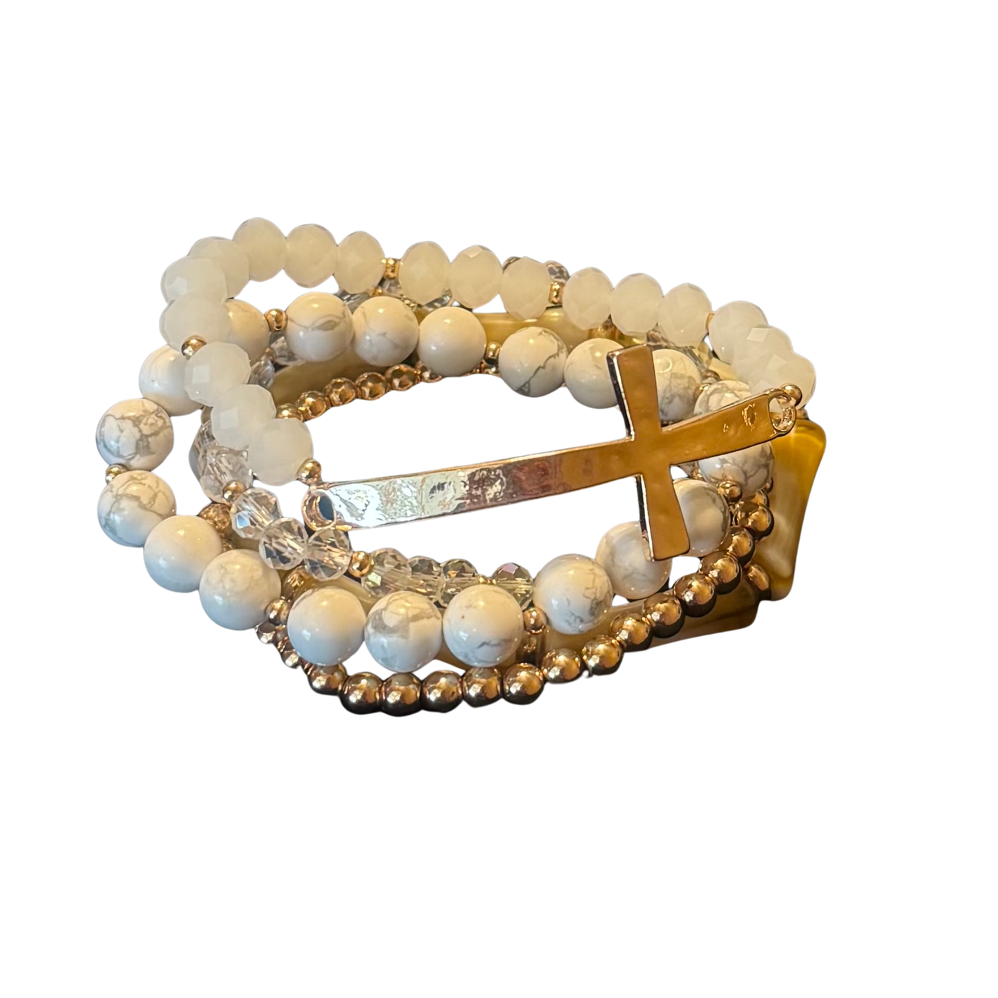 Discover timeless elegance with this curated bracelet collection by Perdido Gems. Each piece combines carefully selected beads with a meaningful cross accent, creating a cohesive set designed for layering. The stretchy construction provides a secure yet comfortable fit that adapts to your wrist, eliminating the need for clasps or adjustments.