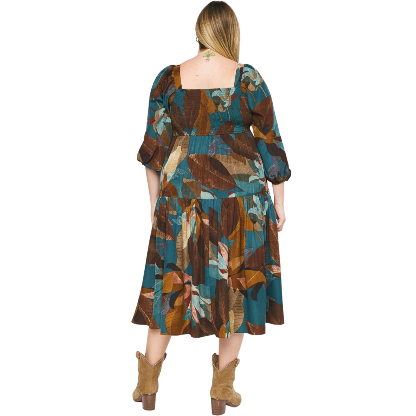 This classic Leaf Printed Maxi Dress features a square neckline, 3/4 length sleeves, and smocked detailing at the back for a comfortable fit. The lightweight, non-sheer, woven fabric is adorned with a stylish leaf print. Perfect for any special occasion.