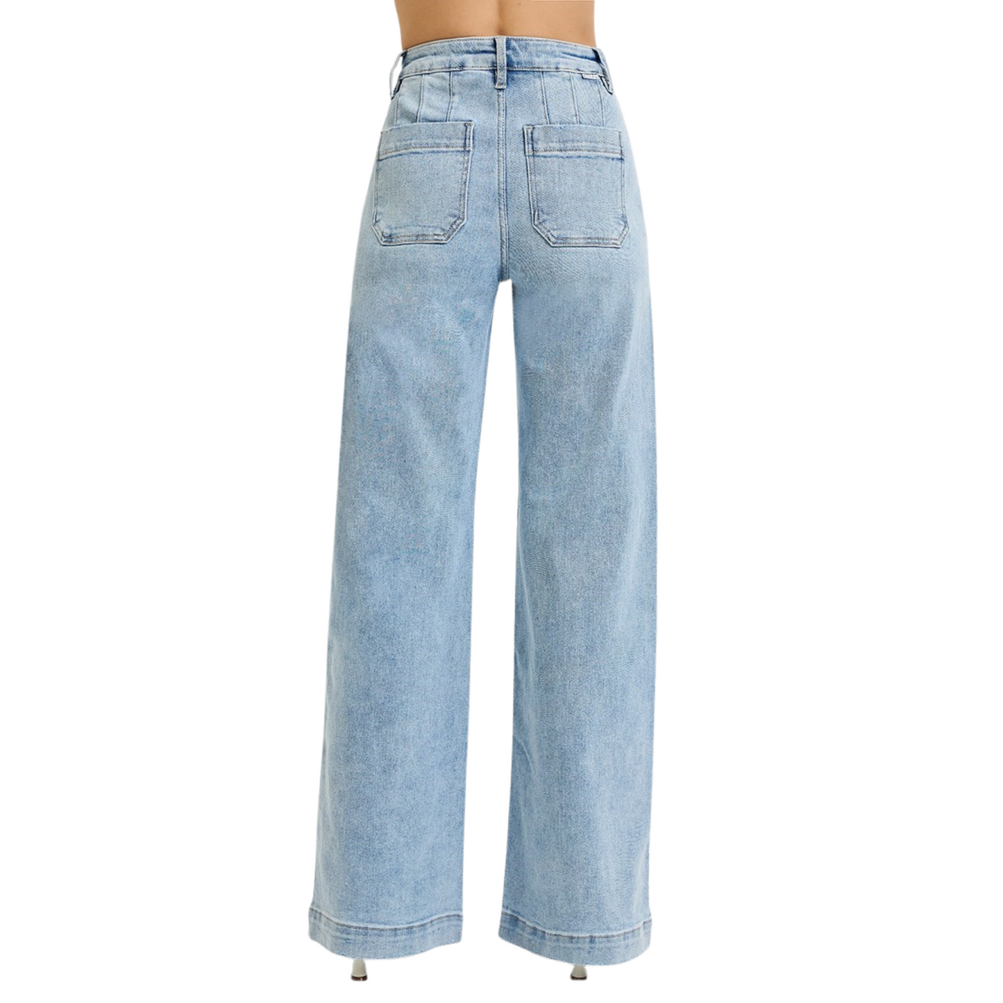These High Rise Wide Leg Jeans by Risen offer a modern silhouette with a relaxed yet flattering fit. Crafted in a light wash, they feature wide legs that provide comfort and movement. Slanted pockets add a functional detail while enhancing the streamlined look. Ideal for stylish everyday wear, these jeans balance classic denim appeal with contemporary design.