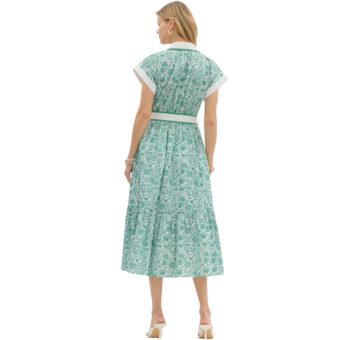 This floral midi shirtdress by Entro is both classy and sophisticated. Featuring a collared neckline, a green and white floral print, short sleeves, and a tie waist, this dress is perfect for any occasion. Stay stylish and comfortable with this versatile piece.