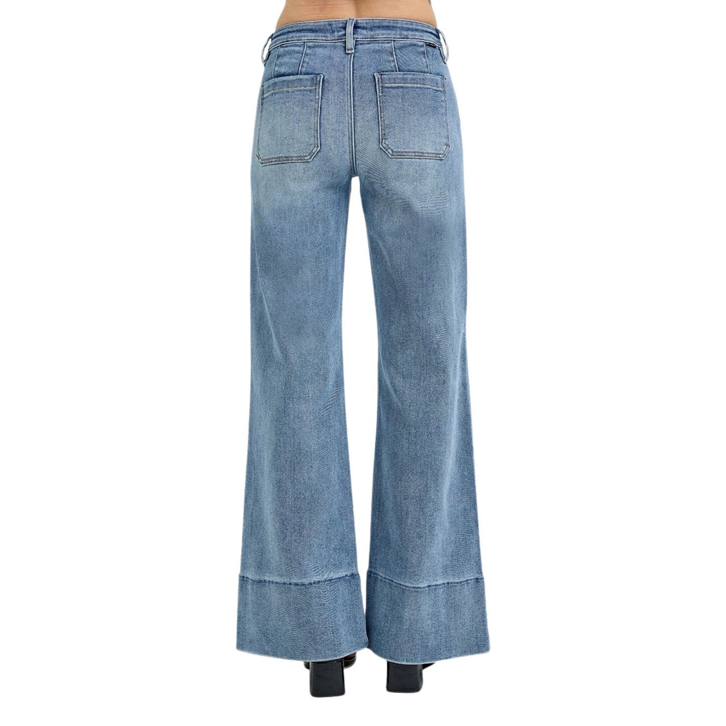 These Mid Rise Wide Flare Jeans from Risen combine a flattering medium wash with a wide leg silhouette to create a timeless, versatile look. Designed to sit comfortably at the mid-rise, they balance style and ease, while the flare shape adds movement and elongates the legs. Crafted for both casual and polished outfits, these jeans offer a sophisticated update to your denim collection.