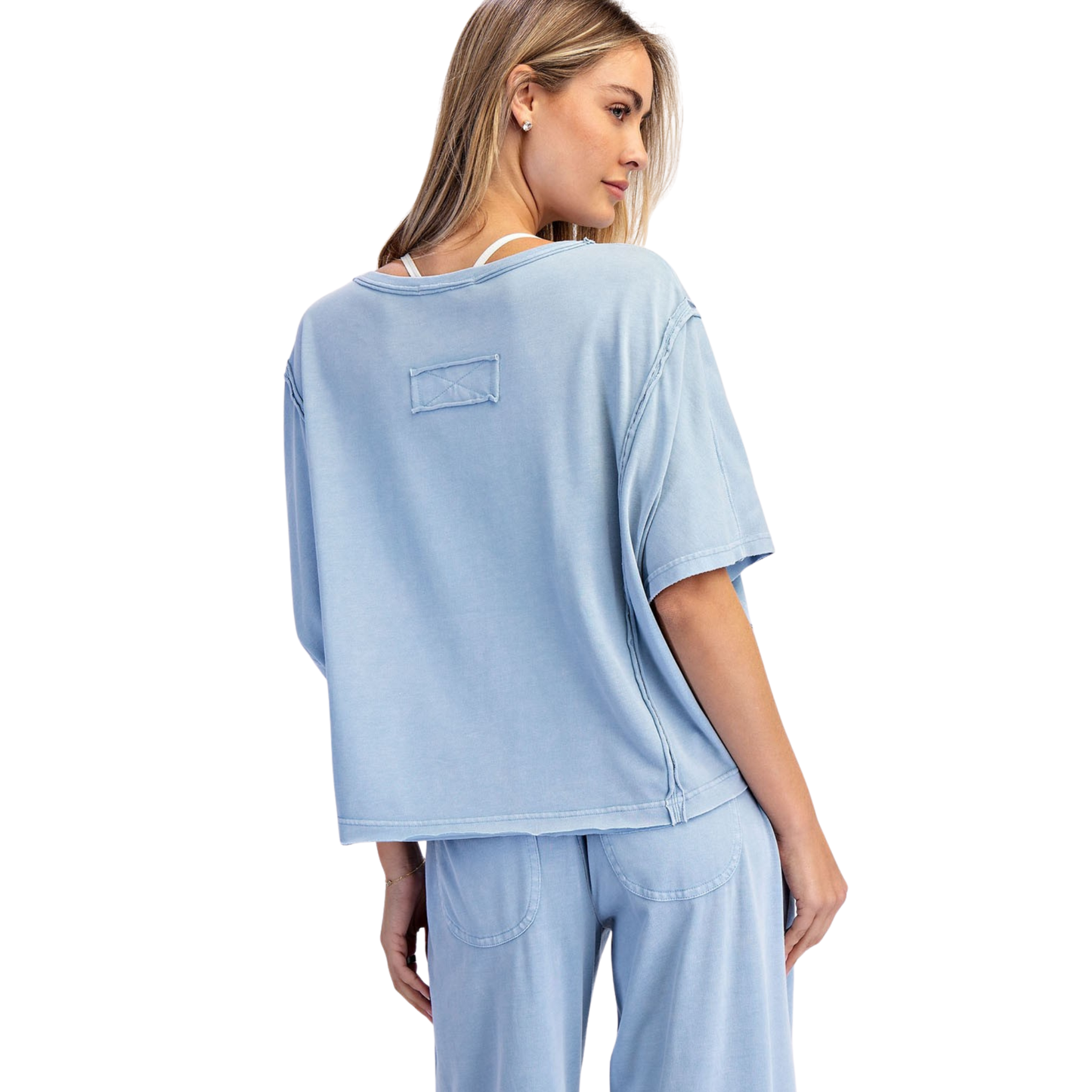 Effortless style meets comfort in this Rae Mode boxy top. The mineral washed finish gives it a relaxed, lived-in aesthetic that pairs perfectly with any casual wardrobe. Cut in a flattering utility blue shade with short sleeves, this piece offers a laid-back silhouette that works for everyday wear. The boxy fit provides ease of movement while maintaining a contemporary look. A versatile essential for creating understated, put-together outfits.
