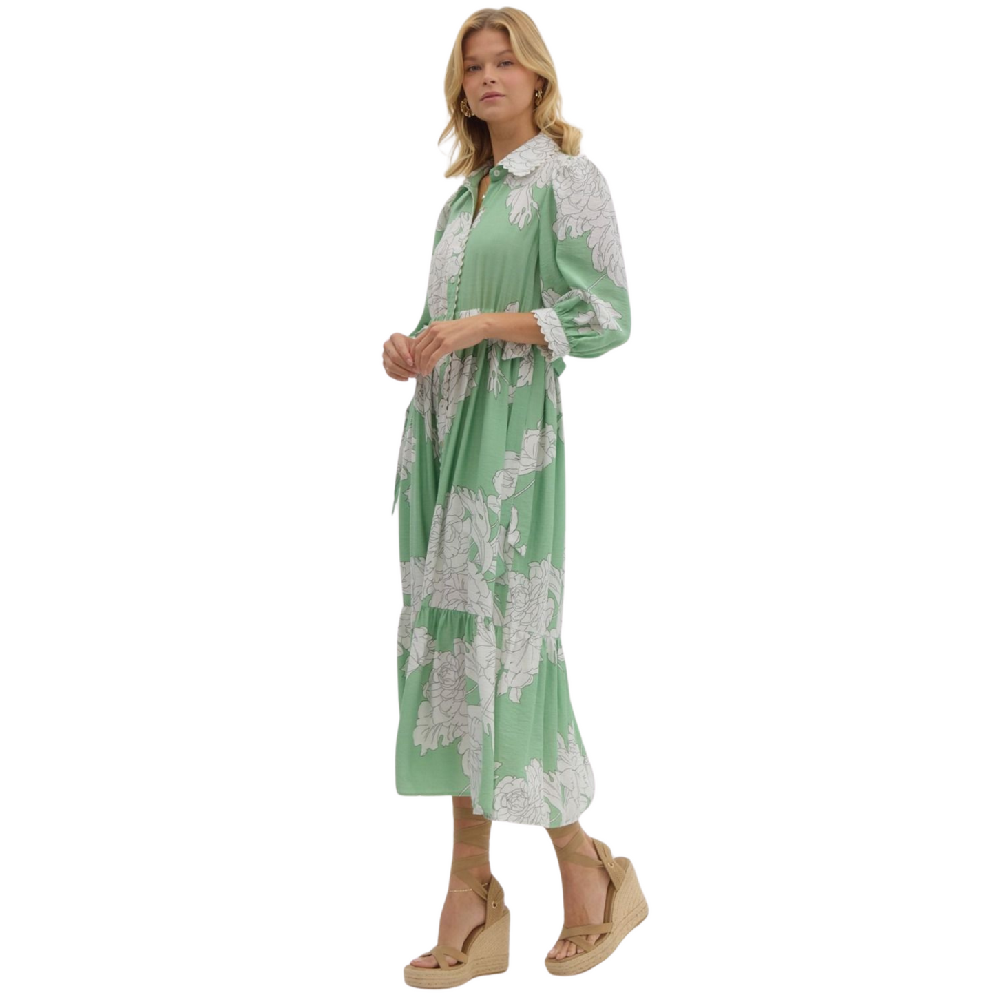 This mint green midi dress from Entro boasts a timeless style with a collared neckline and button-up front. The delicate floral print adds a touch of femininity. Made from high-quality materials, this dress is perfect for any occasion.