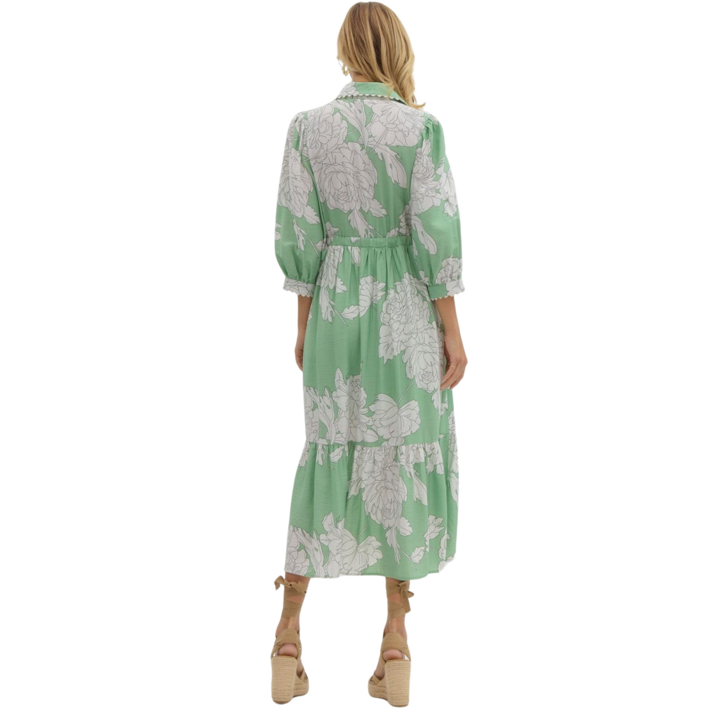 This mint green midi dress from Entro boasts a timeless style with a collared neckline and button-up front. The delicate floral print adds a touch of femininity. Made from high-quality materials, this dress is perfect for any occasion.