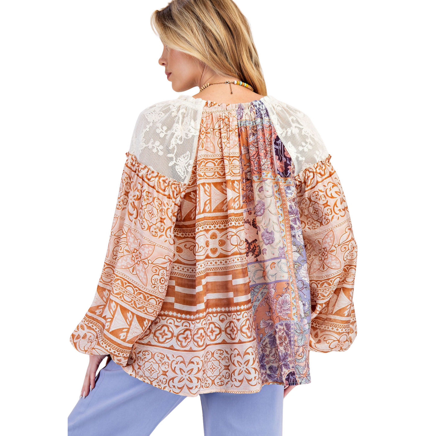 Elevate your wardrobe with the Mixed Print Loose Blouse by Easel. This long-sleeve top features a relaxed, loose fit for comfort and effortless style. Expertly designed with intricate lace accents and a vibrant multicolor print, it offers a sophisticated yet casual look perfect for day-to-night wear. Ideal for those seeking a blend of elegance and ease in their everyday outfits.