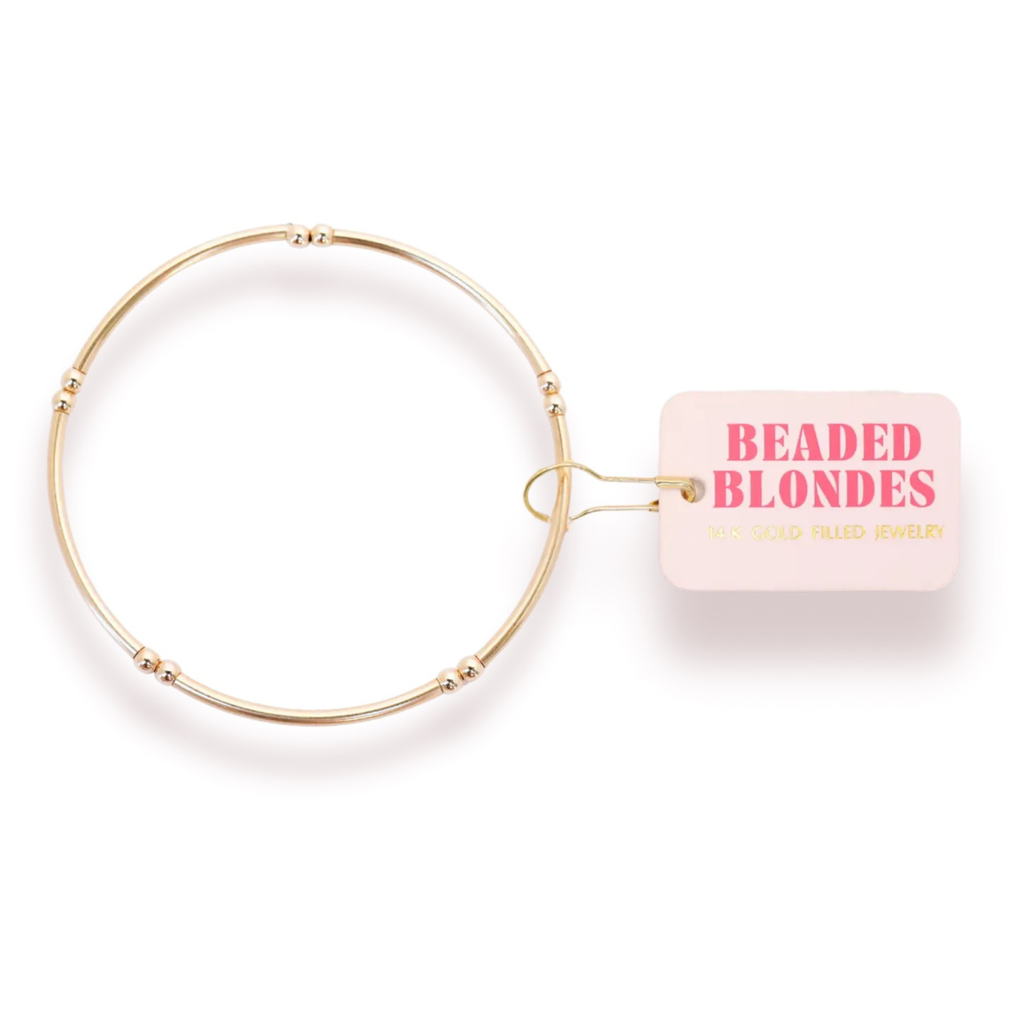 The Mollie bracelet is 3mm with gold bars that fits like a bangle.
• 14 K gold filled & elastic string
• Handstrung in College Station, Texas. Sourced in the US.
• Waterproof, workout proof & tarnish proof
• Care tips - harsh chemicals can cause slight darkening 