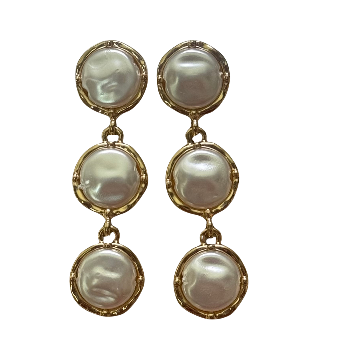 Elevate your everyday elegance with these Mother of Pearl Dangle Earrings from Perdido Gems. Lustrous mother of pearl catches the light beautifully, creating soft iridescent reflections with every movement. Delicate gold accents frame each stone, adding warmth and sophistication to the design. Perfect for layering with other pieces or wearing solo, these versatile earrings transition seamlessly from day to night.