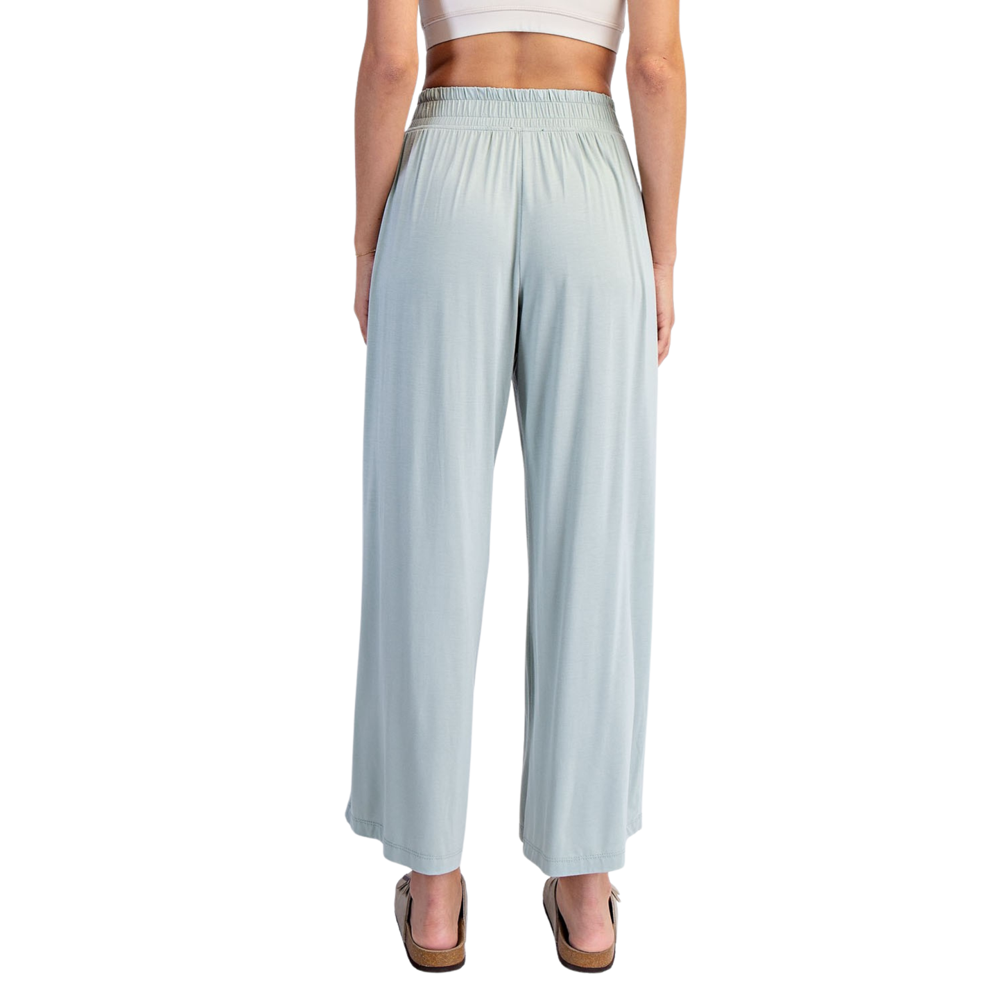 Effortless comfort meets contemporary style with these Rae Mode viscose modal wide leg pants. Crafted in a luxurious moss green hue, these pants feature a relaxed wide leg silhouette that flatters every frame. The elastic waist provides all-day comfort and ease of movement, making them perfect for casual outings or relaxed workdays. The soft, breathable viscose modal fabric drapes beautifully while maintaining its shape. A versatile wardrobe essential that transitions seamlessly from day to night.