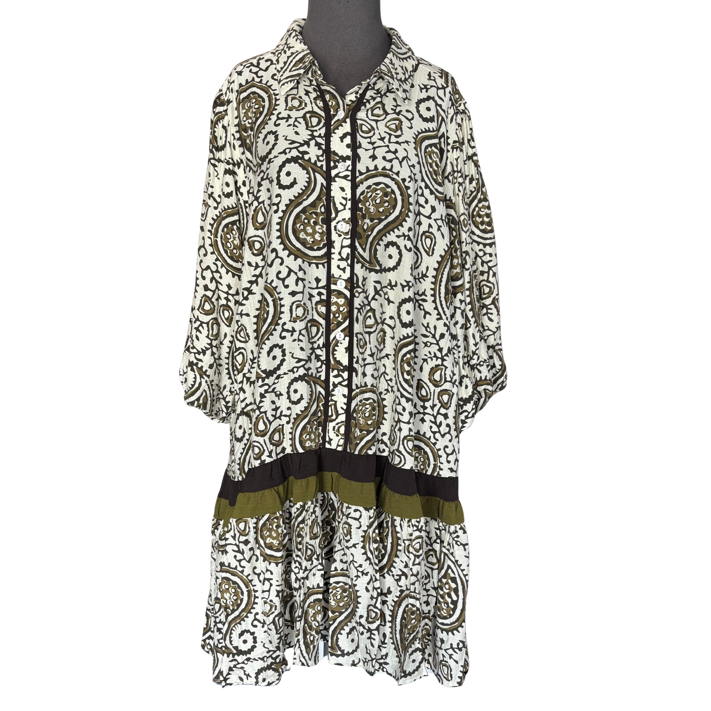 This She + Sky 3/4 Sleeve Button Down Dress features an elegant olive color paired with a classic paisley print, offering a sophisticated yet versatile look. The 3/4 length sleeves provide a balanced silhouette ideal for transitional weather, while the button-down design adds a timeless, polished touch. Perfect for professional settings or casual outings, this dress combines comfort with refined style.