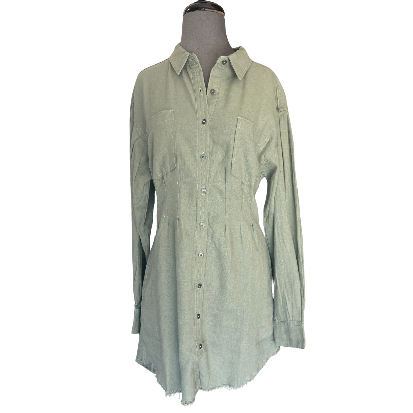 Elevate your wardrobe with our Risen Linen Shirring Sleeve Dress. The olive color adds a touch of sophistication to this button down, collared mini dress. Crafted from linen, it's perfect for any occasion. Upgrade your style game with this must-have piece.