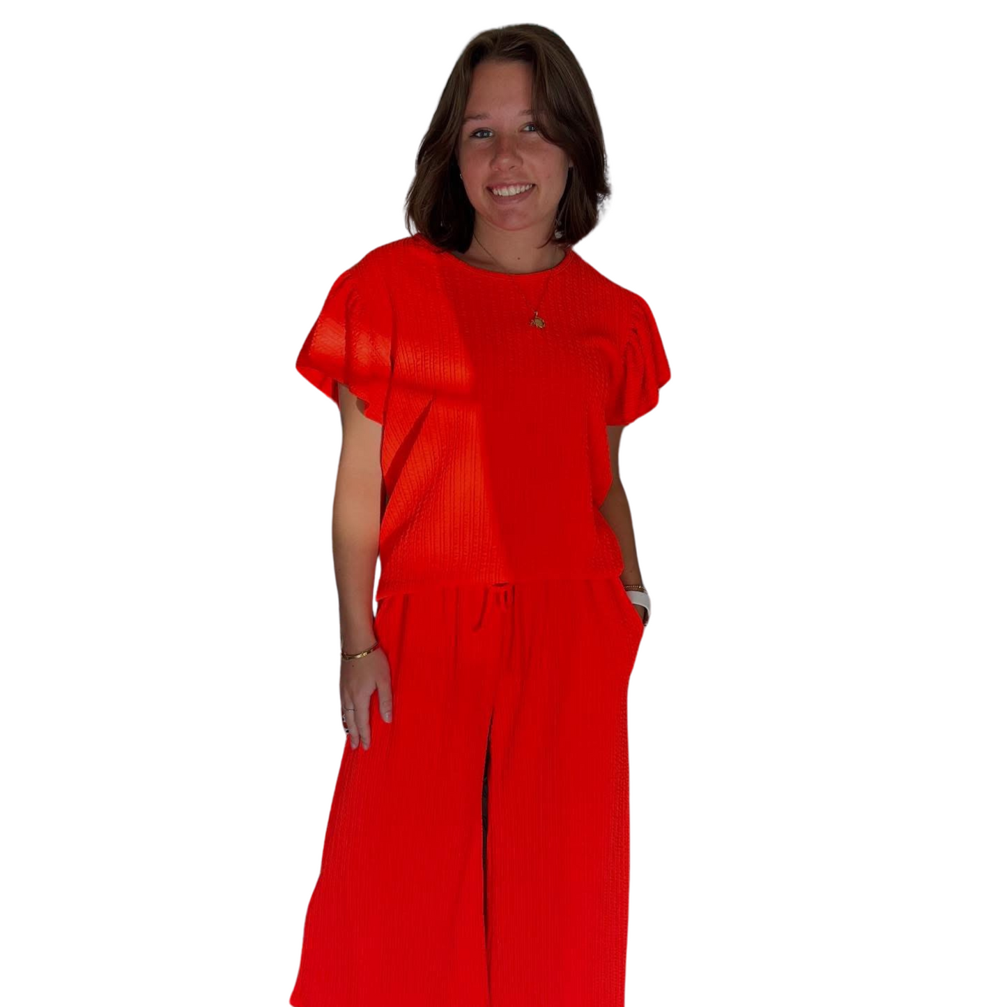 Expertly designed for a vibrant touch, our Flutter Sleeve Top and Bottom Set features a bold neon orange color that will make you stand out. The flutter sleeve top adds a playful touch while the drawstring bottoms ensure a comfortable and adjustable fit. Made from knit fabric, this set provides both style and comfort.