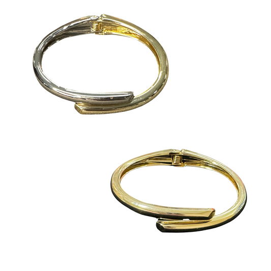 Enhance your jewelry collection with our Overlapped Cuff Bangle. Made from high-quality materials, this bracelet features elegant silver and gold tones that are sure to elevate any outfit. Its cuff design adds a touch of sophistication and versatility, making it a must-have accessory for any occasion.