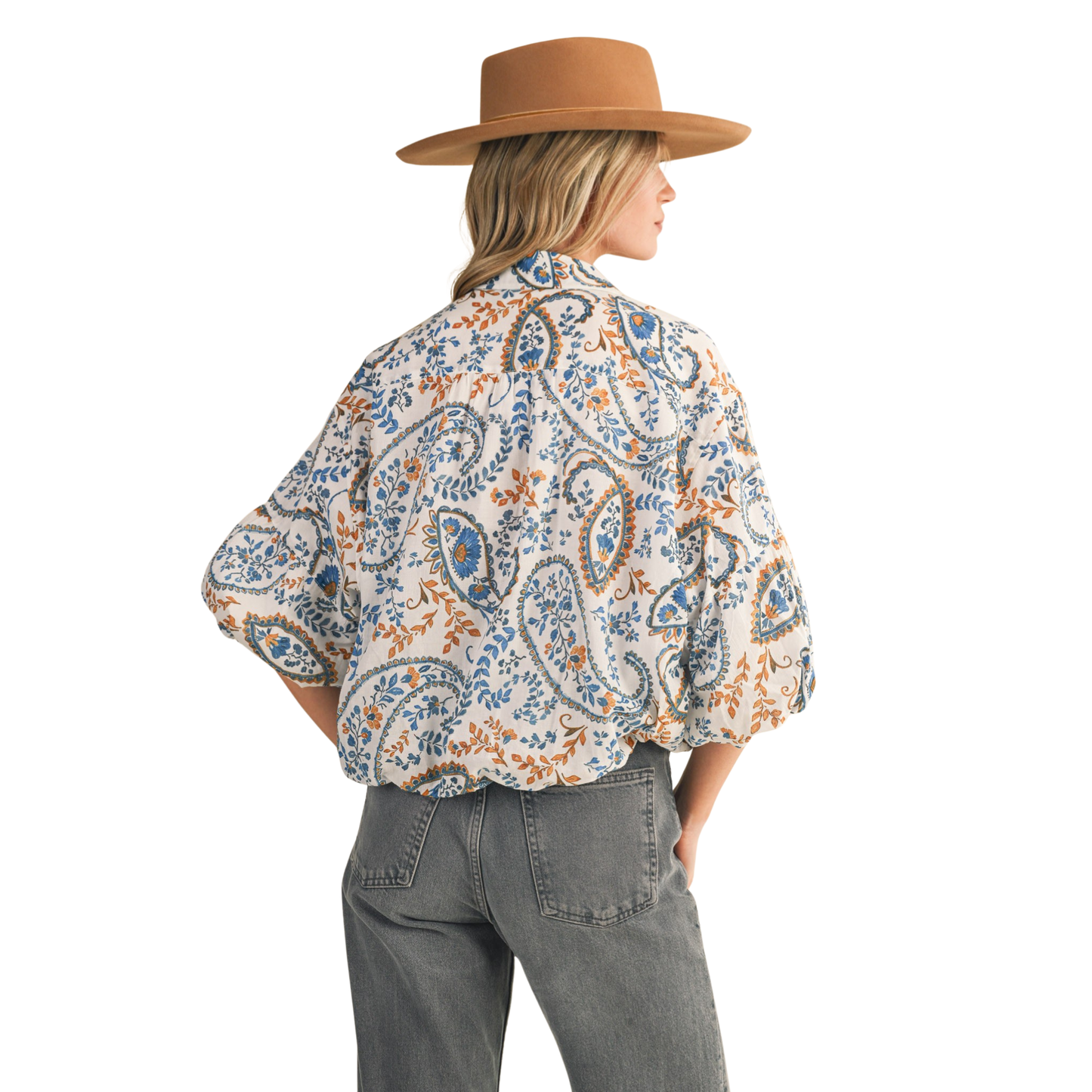 Elevate your wardrobe with this &Merci Paisley Print Top, a sophisticated button-down featuring an intricate blue paisley pattern. The distinctive bubble sleeves add contemporary flair while maintaining a polished silhouette perfect for both professional and casual settings. Crafted with attention to detail, this piece seamlessly transitions from office to weekend wear, offering versatile styling options for the discerning dresser.