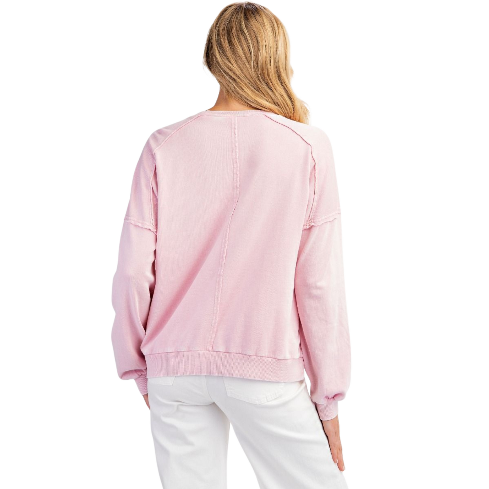 This Mineral Washed Peace Sign Sweatshirt by Easel offers a pale pink, mineral-washed finish that delivers a soft, worn-in feel with a vintage aesthetic. Featuring a long sleeve design and a distinctive peace sign patch, it combines comfort with a timeless symbol of harmony. Perfect for layering or wearing solo, this sweatshirt ensures both style and subtle statement in everyday wear.