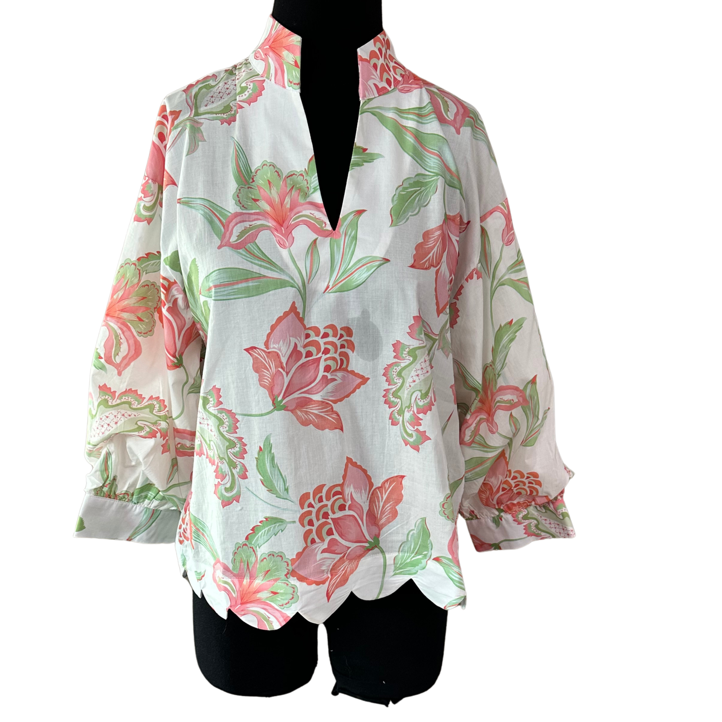 Effortless elegance meets timeless style with this Entro long sleeve top. Crafted in a soft peach tone, the flattering V-neckline frames your face beautifully while the flowing long sleeves provide versatile coverage. Delicate floral print details add feminine charm and visual interest, making this piece perfect for layering or wearing solo. A wardrobe essential that transitions seamlessly from casual days to dressed-up occasions.