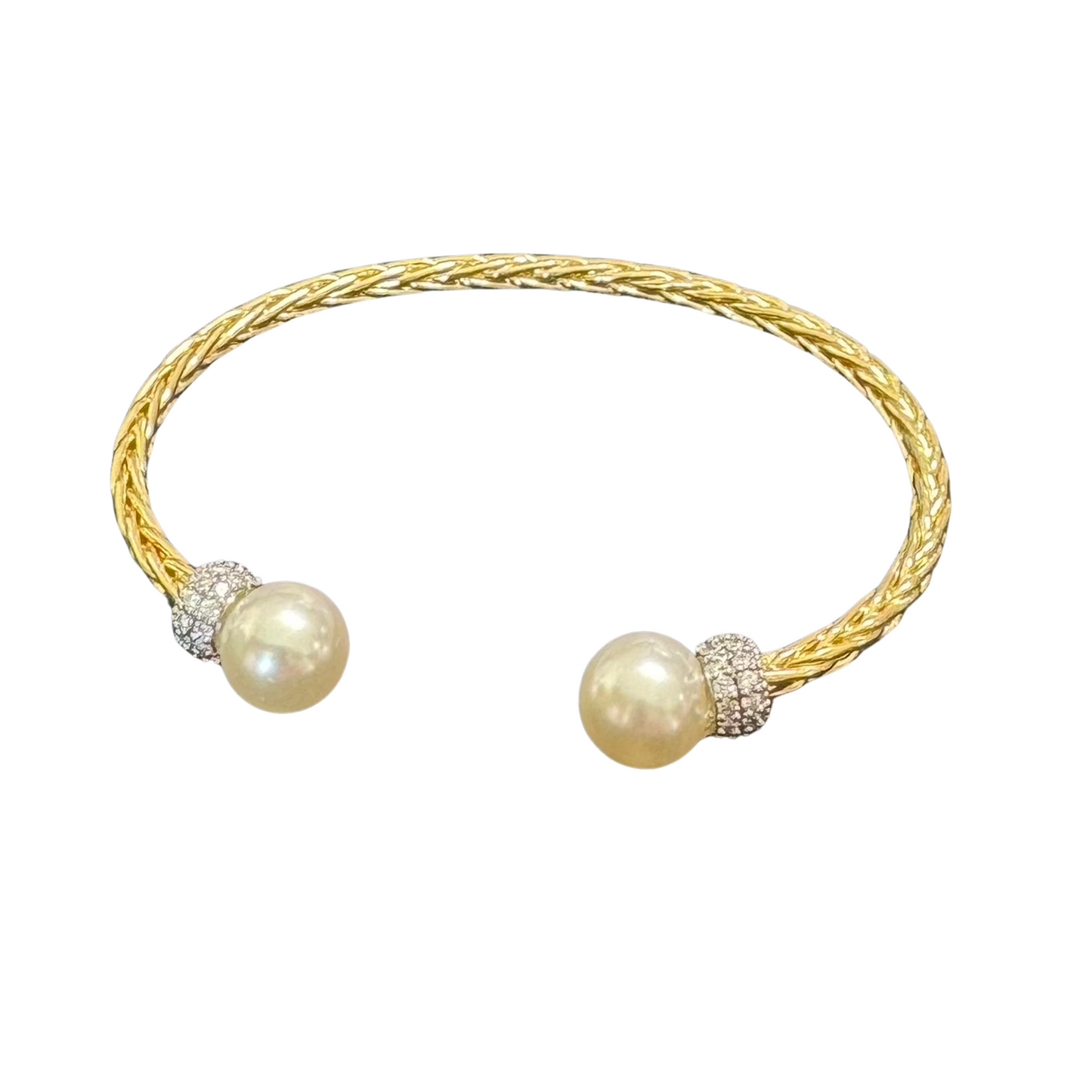 Expertly crafted by Perdido Gem, our Open Ended Cuff Bangle features a twisted design and pearl and rhinestone accents for a touch of elegance. Made with luxurious gold, this open bangle bracelet adds an effortless and timeless appeal to any outfit. Elevate your style with this must-have accessory.