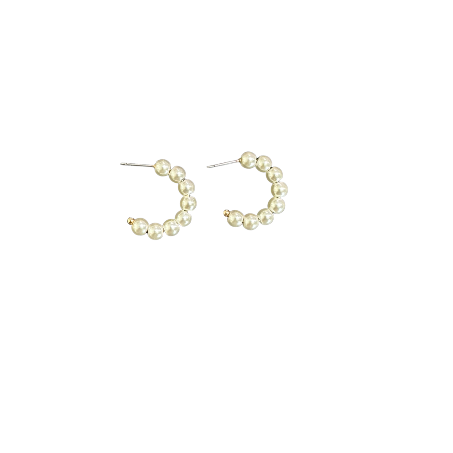 Elevate your everyday look with these timeless Pearl Hoop Earrings from Perdido Gems. Delicate pearl accents nestle within sleek gold-toned hoops, creating a sophisticated balance of classic and contemporary style. Perfect for layering or wearing solo, these small hoops transition seamlessly from day to night. The lustrous pearls catch the light beautifully, while the gold accents add warmth and dimension. A versatile essential for any jewelry collection.