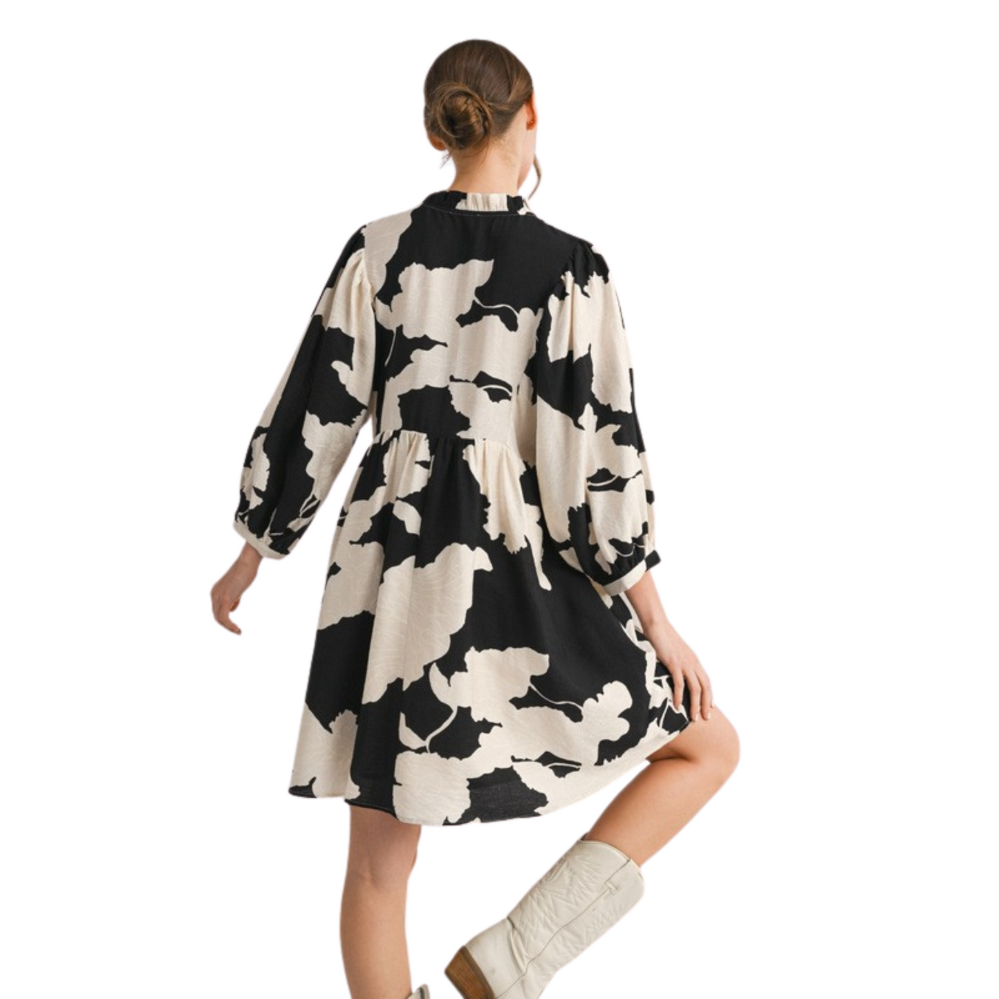 This Jodifl Loose Fit Peasant Dress features an eye-catching black and white abstract print that elevates its modern appeal. Designed with a tie-front detail, it offers adjustable styling and a flattering silhouette. Its mini length and relaxed fit provide comfort and effortless movement, making it a versatile choice for both casual outings and stylish events. Crafted for ease and impact, this dress combines contemporary design with timeless comfort.