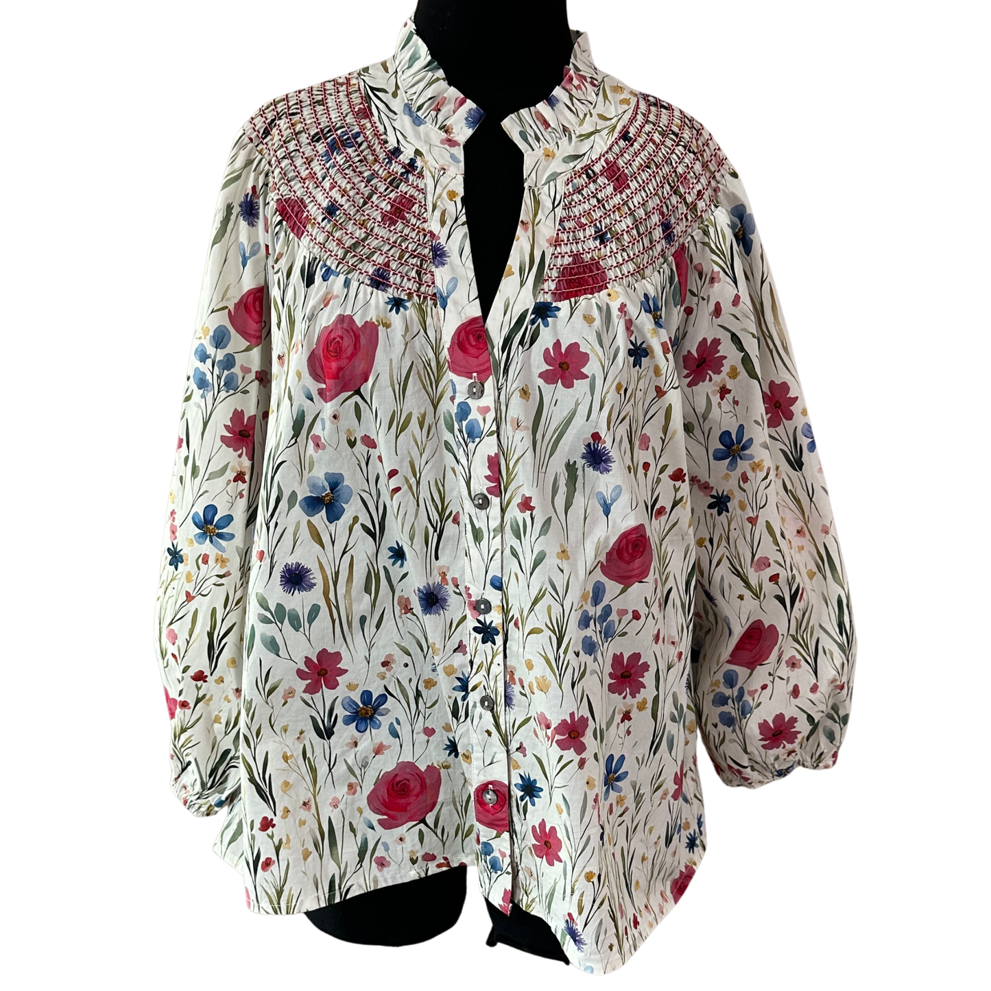 Elevate your wardrobe with this charming Floral Print V-Neck Top by Entro. Featuring a delicate pink floral design, this piece combines feminine style with comfortable sophistication. The flattering v-neckline draws attention upward, while intricate smocking detail at the bodice adds texture and visual interest. Three-quarter length sleeves offer the perfect balance between coverage and breathability, making it ideal for layering or wearing solo.