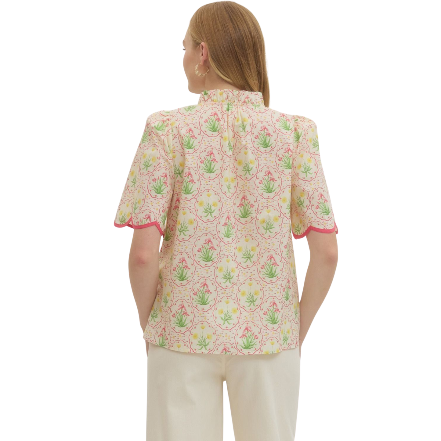Elevate your wardrobe with this charming Pink Floral Top by Entro. Featuring a delicate floral print in soft pink tones, this piece brings effortless femininity to any outfit. The short sleeves offer comfortable everyday wear, while decorative button accents add a touch of sophistication. A scalloped hem creates a refined, polished finish that flatters the silhouette. Perfect for casual outings, brunch, or layering under your favorite jacket.