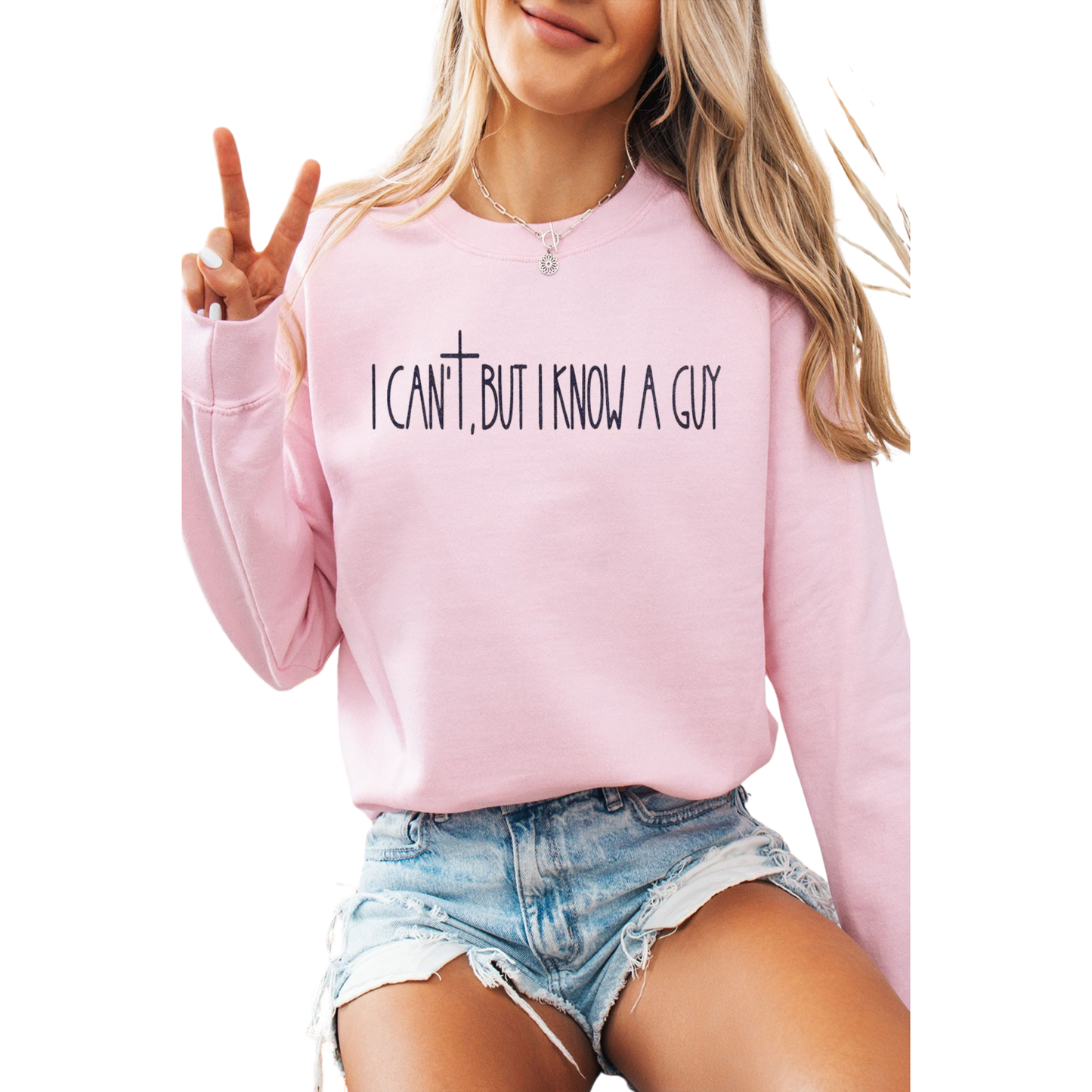 I Can't, but I Know a Guy Sweatshirt in pink features a striking graphic design centered around a cross motif, crafted by Caramel brand. This long-sleeve sweatshirt combines comfort with bold visual appeal, making it an ideal choice for those seeking meaningful style. The thoughtful design works as both a conversation starter and a statement piece, perfect for casual wear or layering. Quality construction ensures durability through regular wear and washing. Whether you're drawn to the symbolic cross design
