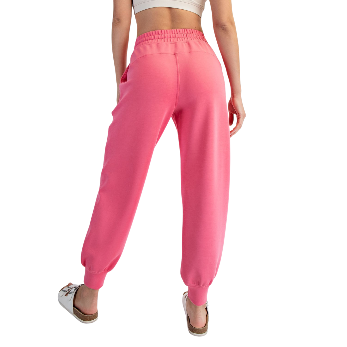 Elevate your loungewear collection with these Modal Scuba Joggers from Rae Mode. Crafted in a vibrant bright pink, these joggers combine comfort with contemporary style. The elastic waist and adjustable drawstring provide a customizable fit, while the soft modal-scuba blend fabric offers breathability and ease of movement. Perfect for relaxing at home, running errands, or casual outings. The jogger silhouette flatters while maintaining that effortless, laid-back vibe you're looking for.