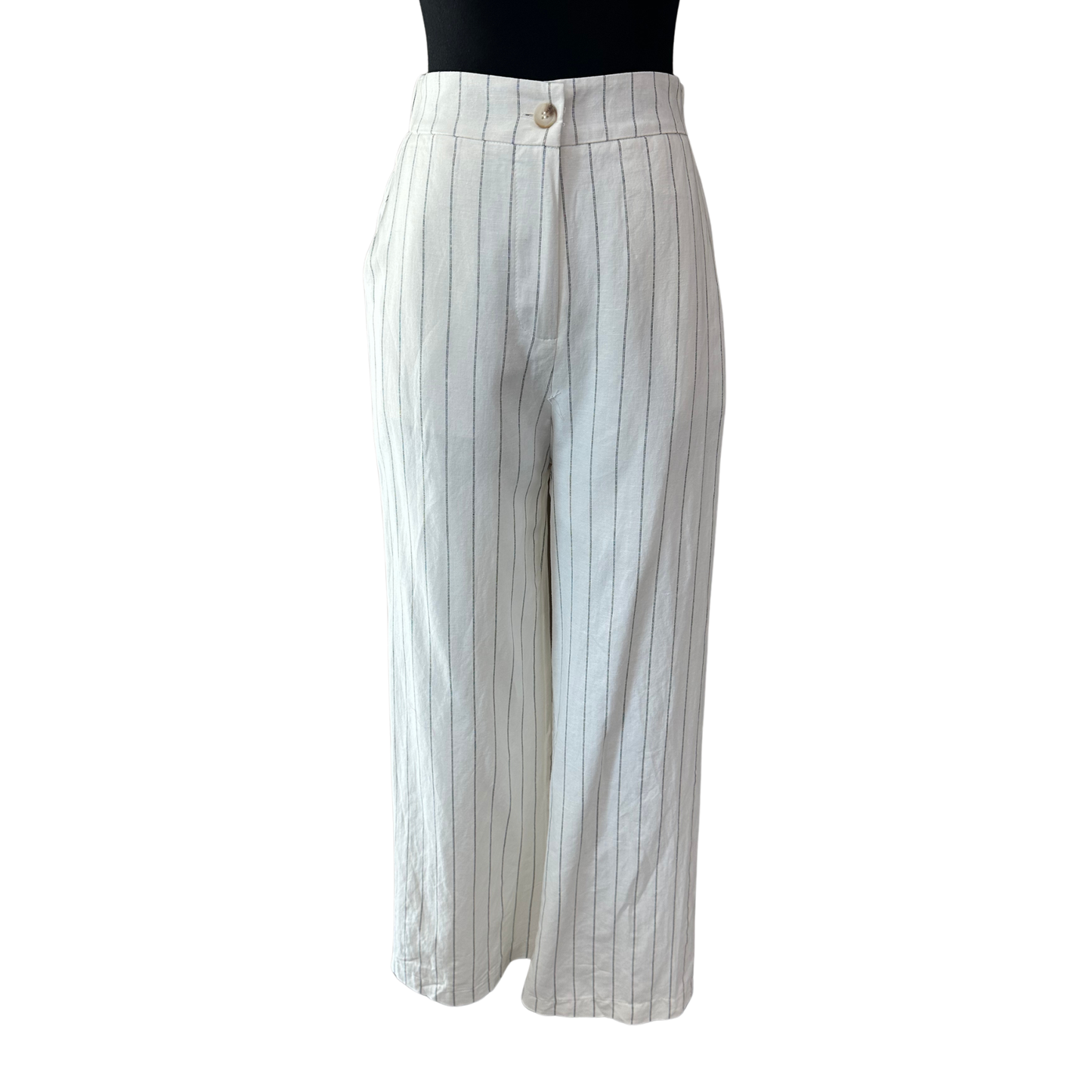 Elevate your casual wardrobe with these Pin Striped Cropped Pants from She+Sky. Featuring a classic white and black pin stripe pattern, these pants offer a timeless look that pairs effortlessly with any top. The convenient front button closure ensures a secure, comfortable fit. Perfect for creating polished everyday outfits or dressing up for a night out.
