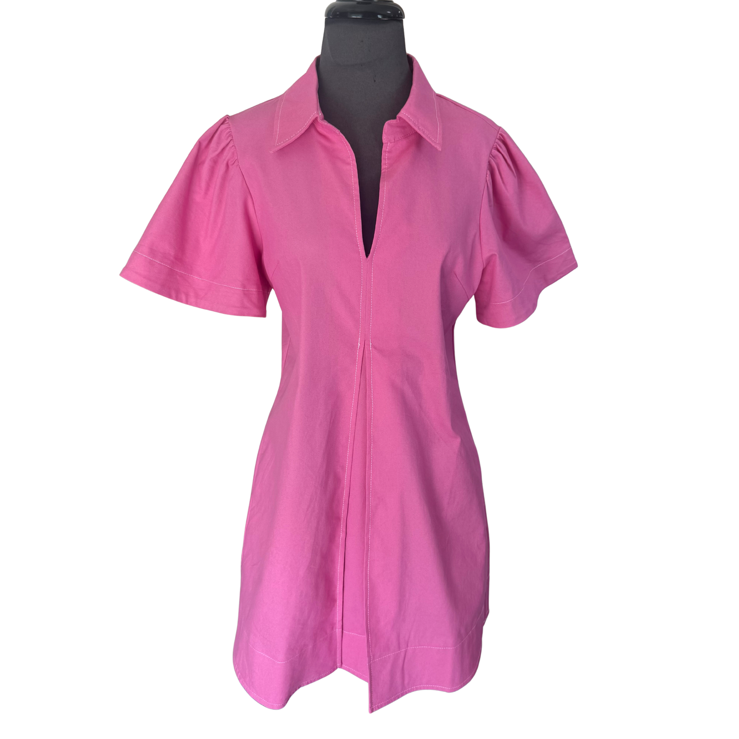 Elevate your wardrobe with this stunning Glam pleated mini dress. The flattering V-neck and crisp collar create a polished silhouette, while the soft pink hue adds a touch of feminine charm. Perfectly tailored pleats provide movement and dimension, making this dress ideal for casual outings, brunch dates, or weekend adventures. The mini length showcases your style with confidence. A versatile piece that transitions effortlessly from day to night.