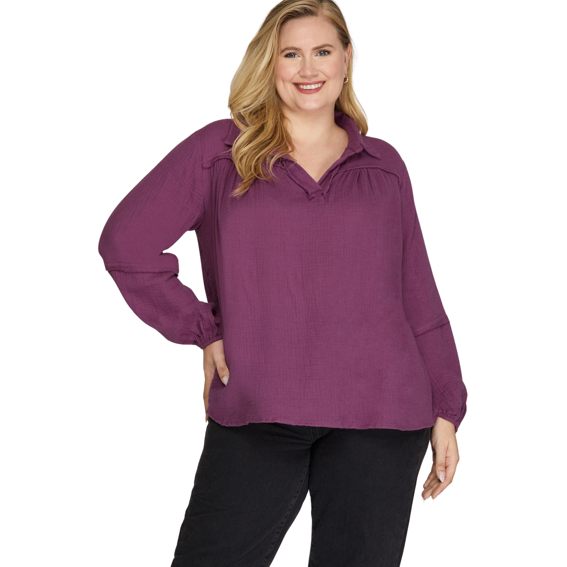 This She+Sky long sleeve woven top features a flattering V-neck and a classic collar, designed to enhance plus-size silhouettes with comfort and style. The rich plum color adds a sophisticated touch, making it versatile for both professional and casual occasions. Its breathable fabric ensures all-day wearability while the tailored fit offers a polished look. Perfect for those seeking a balance of elegance and ease in their wardrobe.