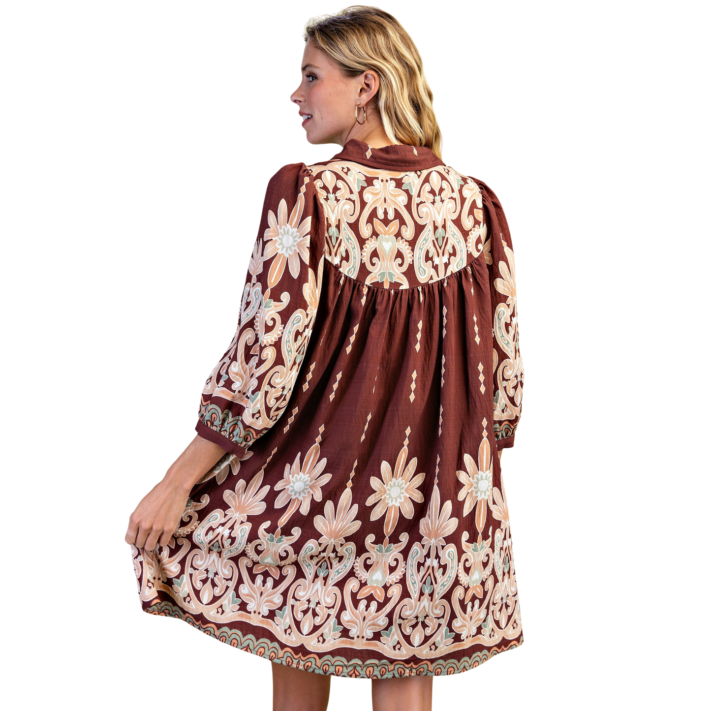 Elevate your everyday style with this charming Printed Shirt Dress by GiGio. Featuring a rich brown mix print, this mini dress combines classic sophistication with modern flair. The three-quarter length sleeves provide the perfect balance of coverage and breathability, making it ideal for transitional seasons. Versatile enough for casual outings or dressed up for special occasions, this piece is a wardrobe essential that works effortlessly from day to night.