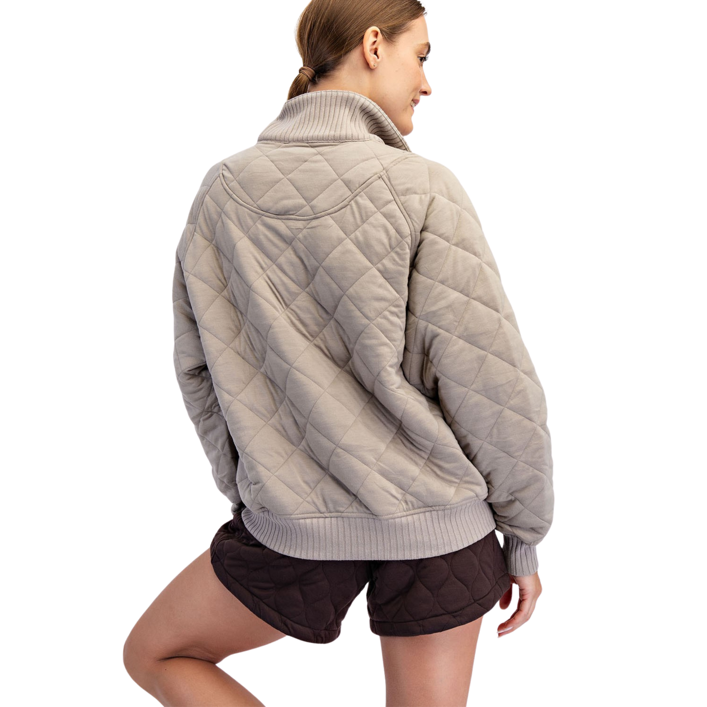 The Rae Mode Quilted Snap Pullover in taupe features a sophisticated quilted design for added texture and warmth. Equipped with convenient snap buttons, it offers easy wear and adjustable comfort. This pullover combines functional details with a refined look, making it an ideal layering piece for cooler days.