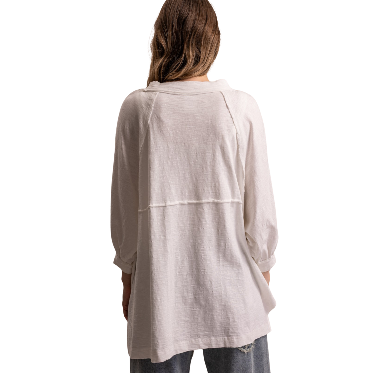 Elevate your everyday wardrobe with this oversized raglan top from Blue Velvet. Crafted in a soft off-white hue, the relaxed silhouette pairs effortlessly with jeans, skirts, or joggers. The 3/4 length sleeves offer versatile layering potential while maintaining a comfortable, laid-back aesthetic. Perfect for casual outings, weekend lounging, or creating an understated, polished look. A wardrobe essential that transitions seamlessly from season to season.