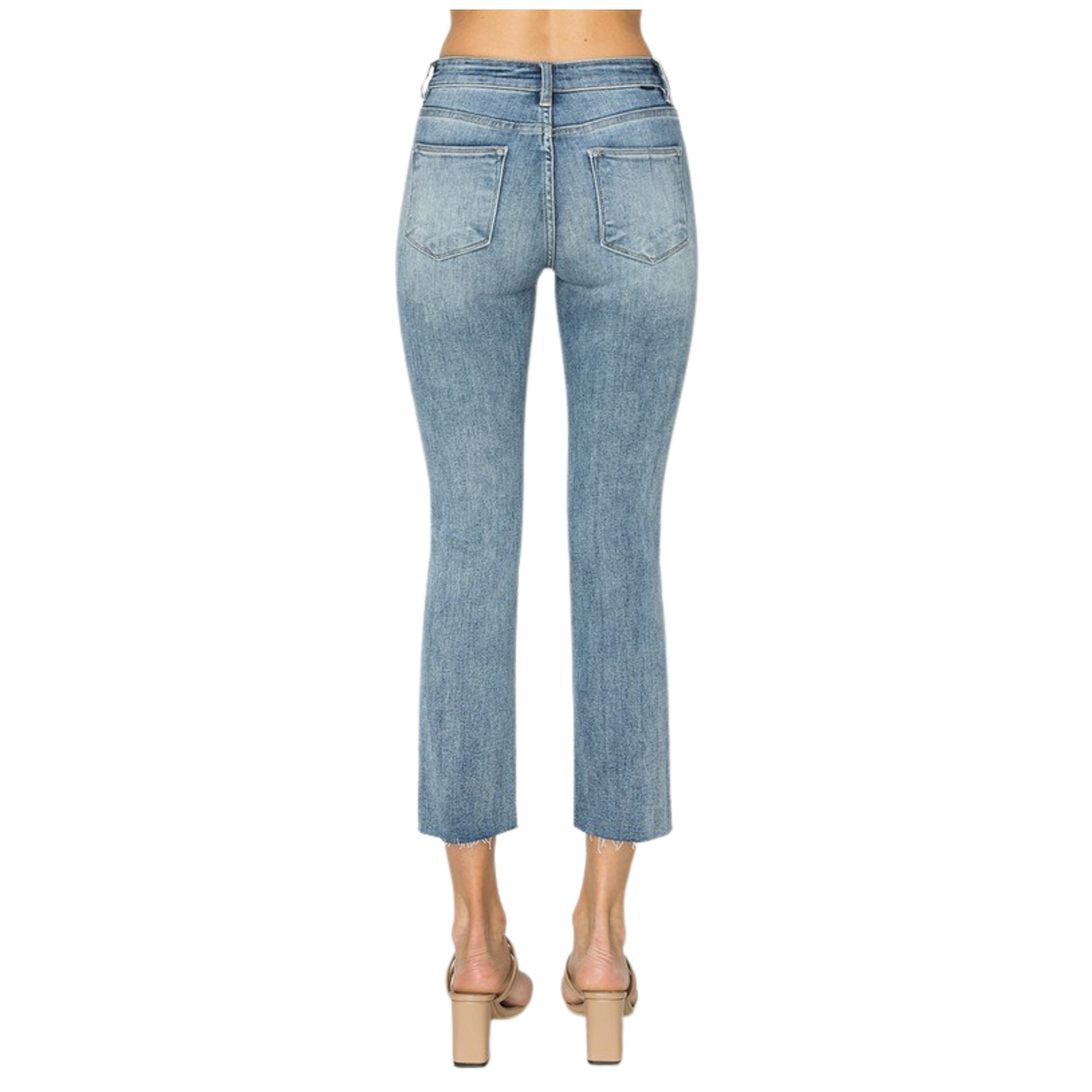 These Mid Rise Raw Edge Jeans from Risen feature a medium wash and a straight leg cut for a timeless silhouette. The raw edge hem adds a contemporary, slightly distressed detail, enhancing the jean’s casual appeal. Designed with expert craftsmanship, they balance style and comfort, making them a versatile addition to your wardrobe.