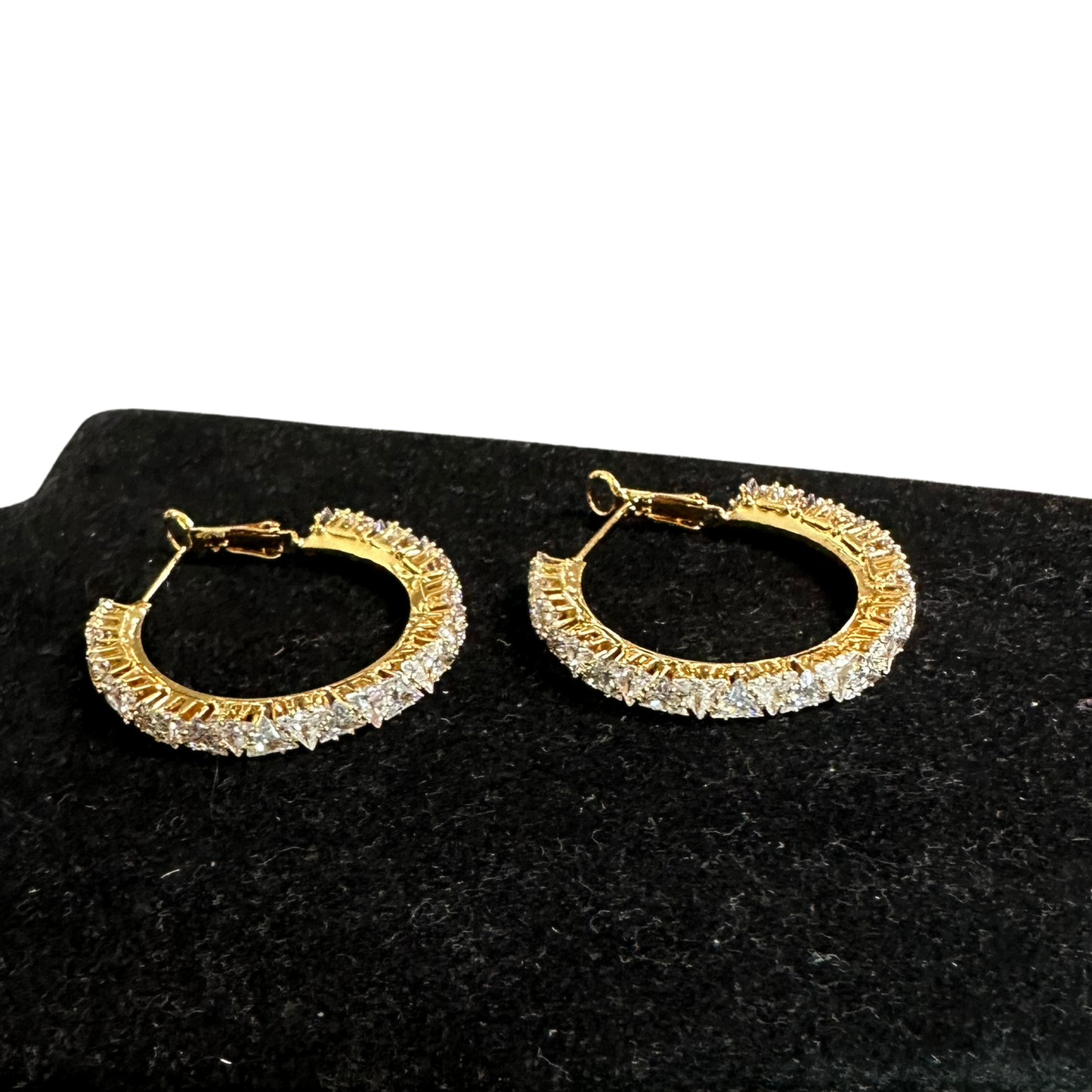Elevate your everyday look with these stunning Rhinestone Hoop Earrings from Perdido Gems. Crafted with lustrous gold-tone metal, these hoops feature dazzling rhinestone accents that catch the light beautifully. The classic hoop silhouette offers versatile style—perfect for casual outings or special occasions. Lightweight and comfortable for all-day wear, these earrings are a must-have addition to any jewelry collection.