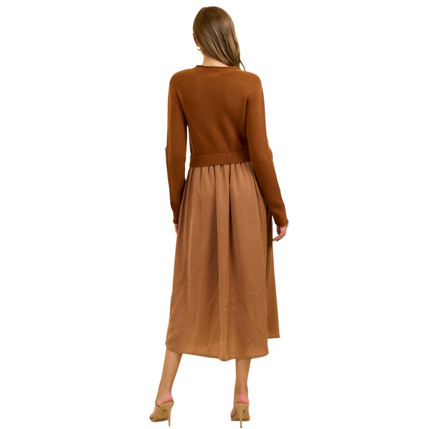 This ribbed knit maxi dress in a rich mocha shade from Doe and Rae combines comfort with sophistication. The soft, stretchy fabric contours gently to the body, offering a flattering fit while ensuring ease of movement. Its sweater top design adds warmth and versatility, making it ideal for both casual and dressier occasions. Perfect for layering or wearing alone, this dress is a refined choice for those seeking effortless style in cooler seasons.