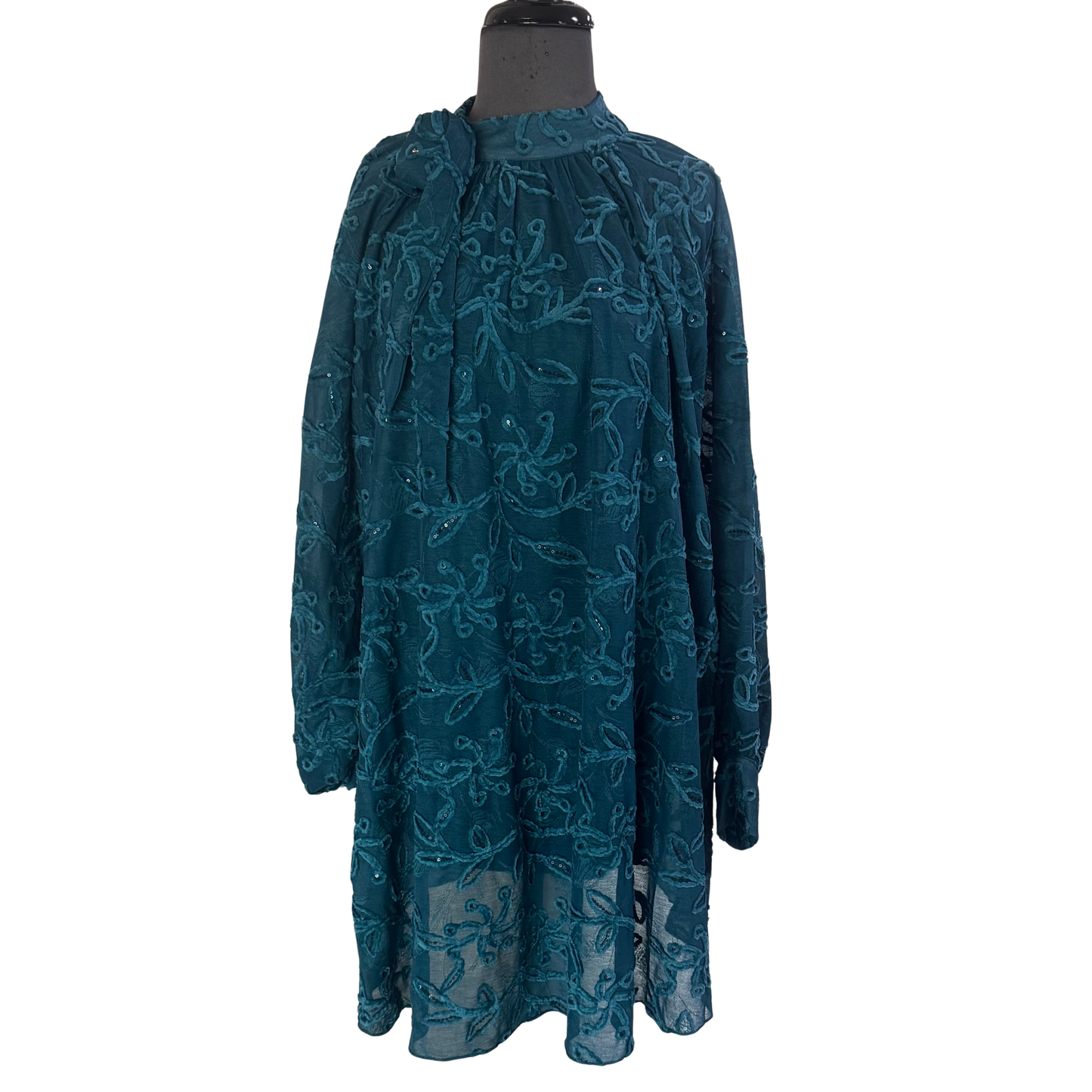 Elevate your evening look with this stunning teal mini dress from GiGio. Crafted from textured fabric, this piece features eye-catching lantern sleeves that add dramatic flair and movement. The sequin embellishments catch the light beautifully, while an elegant tie detail at the neck creates a refined finishing touch. Perfect for cocktail events, parties, or nights out, this dress combines sophistication with playful style.