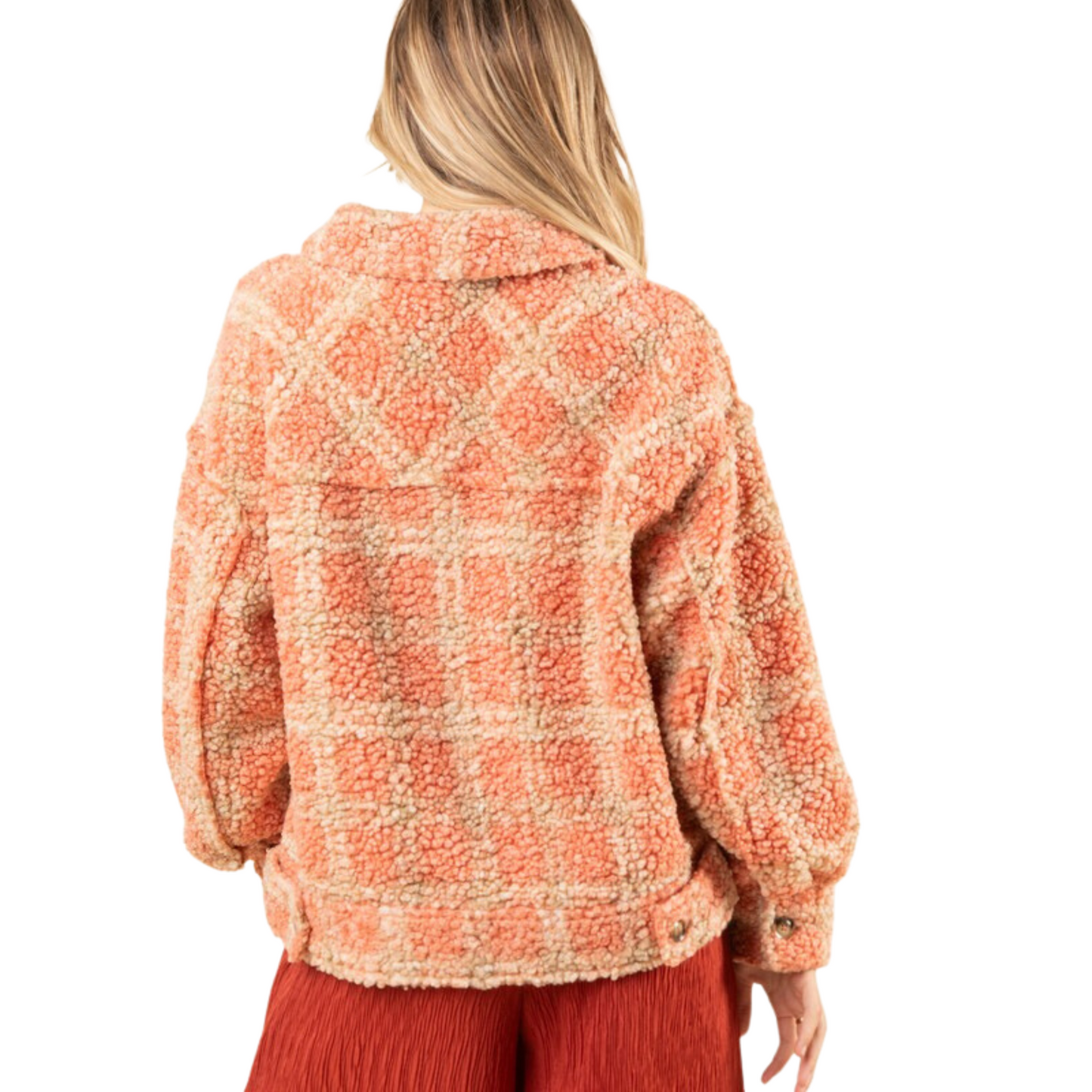 This oversized plaid shacket is perfect for combining comfort and style. It features a drop shoulder design with long sleeves, and is button-up with front pockets. The cozy sherpa material adds warmth, making this shacket a great choice for the winter months.