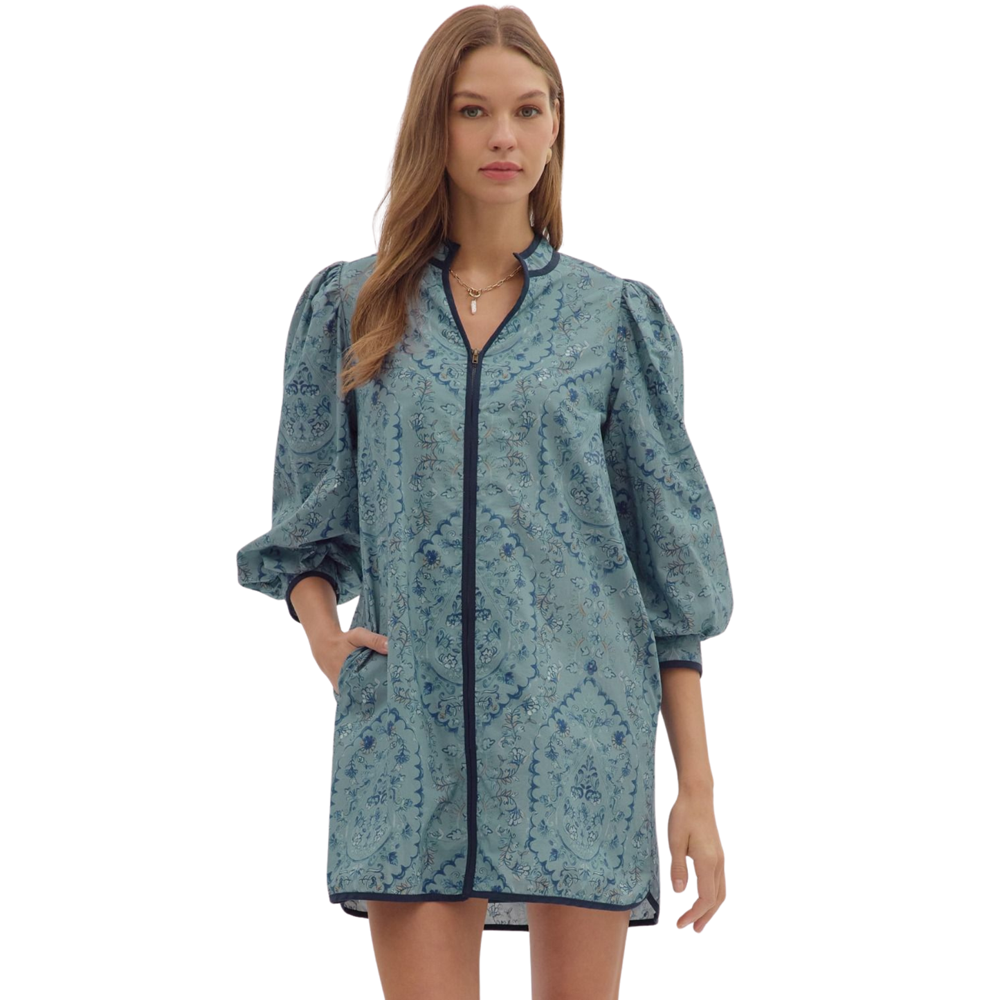 This Entro mini dress in a sophisticated slate blue features 3/4 length sleeves, offering a balanced blend of elegance and comfort. Its sleek silhouette is perfect for a refined, contemporary wardrobe, making it an ideal choice for both day and evening occasions. The quality craftsmanship ensures durability while enhancing your style with a subtle yet striking hue.