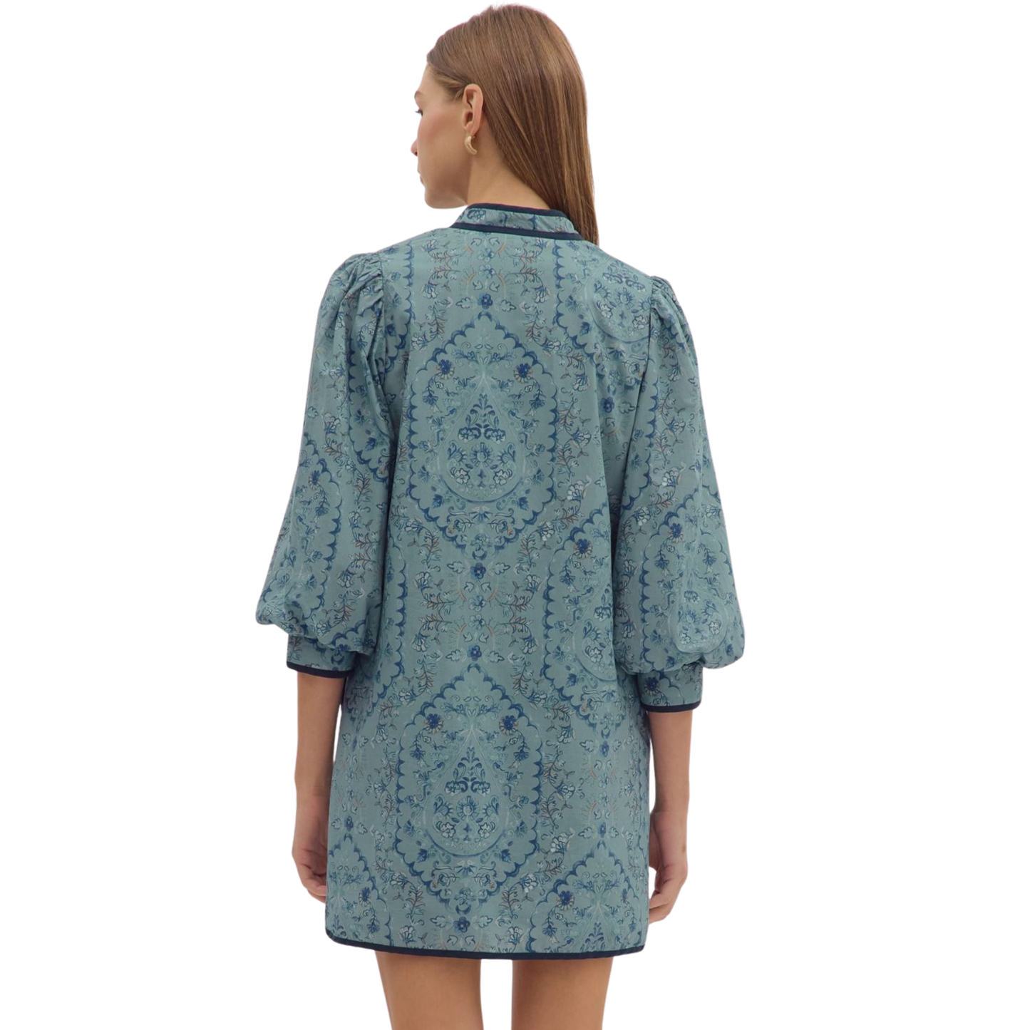 This Entro mini dress in a sophisticated slate blue features 3/4 length sleeves, offering a balanced blend of elegance and comfort. Its sleek silhouette is perfect for a refined, contemporary wardrobe, making it an ideal choice for both day and evening occasions. The quality craftsmanship ensures durability while enhancing your style with a subtle yet striking hue.