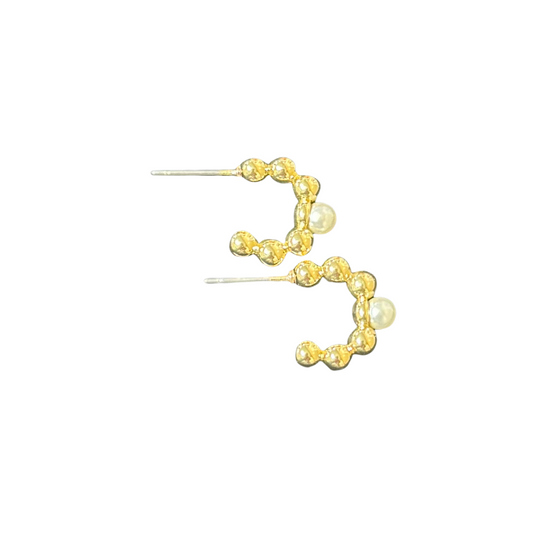 Experience elegance and sophistication with our Small Beaded Hoops from Tell Your Tale. These small hoop earrings feature delicate gold beads and a stunning pearl accent, perfect for adding a touch of glamour to any outfit. Elevate your look with these timeless and versatile accessories.