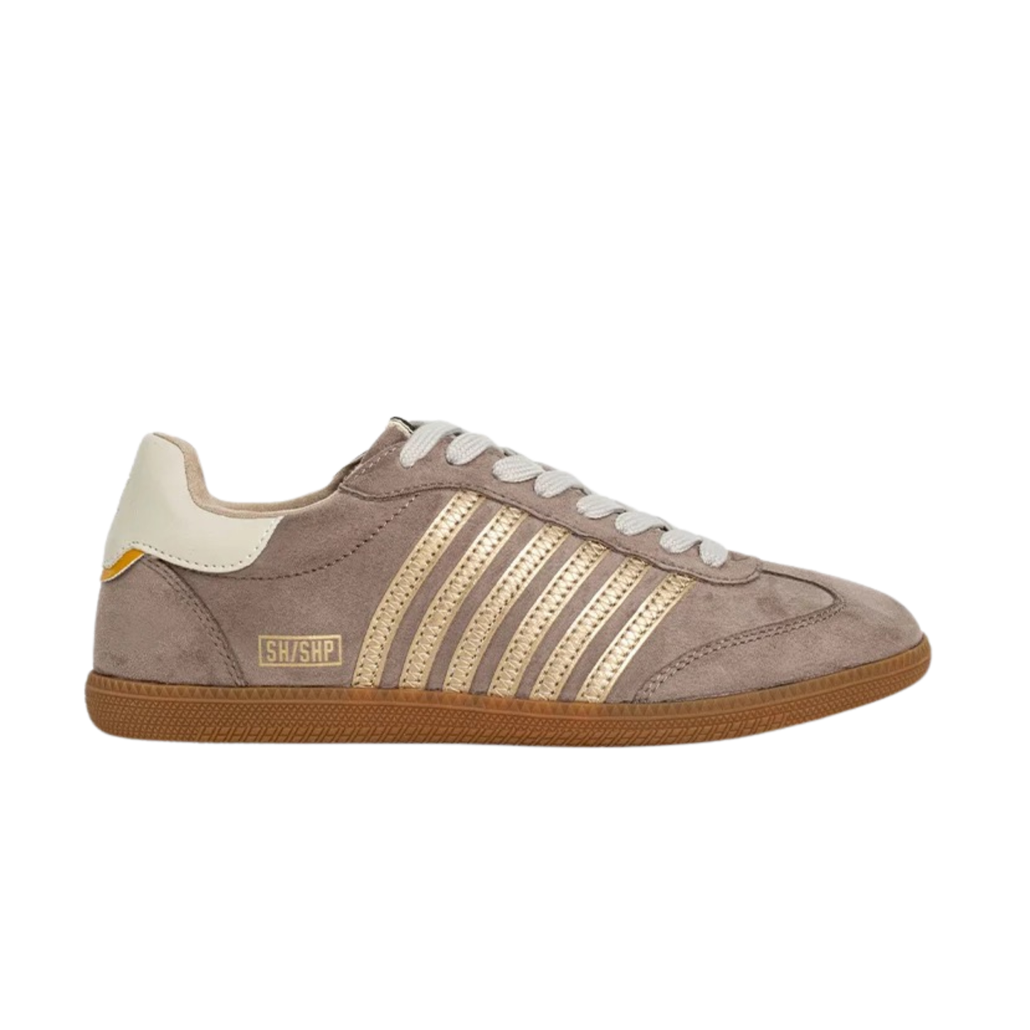 The Stevie sneaker from ShuShop combines luxe mink suede with everyday wearability. Crafted in a sophisticated taupe hue, these shoes deliver soft comfort and refined style. Perfect for elevating casual outfits with an understated touch of elegance.