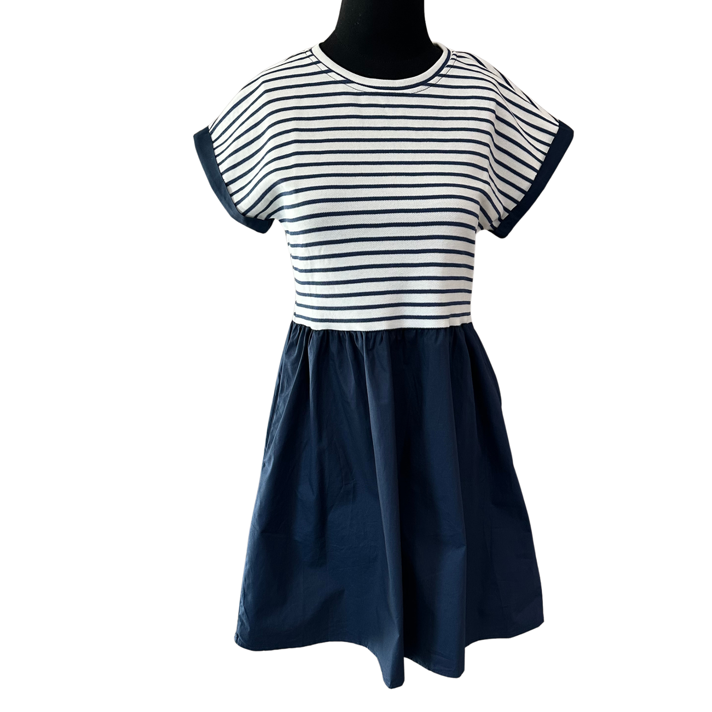 Effortless style meets everyday comfort in this She+Sky striped short sleeve mini dress. The navy colorway pairs perfectly with sneakers or sandals for a versatile look that transitions seamlessly from casual outings to weekend adventures. The relaxed fit and breathable fabric make it an ideal choice for warm weather wear. Perfect for building a wardrobe of timeless basics that work hard and look great.