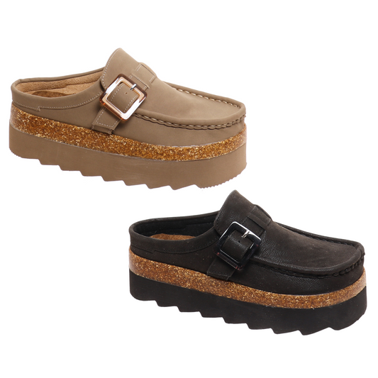 The Sunday-2 mule from Outwoods combines sophisticated design with comfort. Featuring a sleek black or taupe finish and an open back, this platform mule offers easy wear and a modern silhouette. The adjustable buckle design ensures a secure fit, while the elevated platform adds subtle height without compromising stability. Ideal for those seeking a stylish yet practical footwear option.