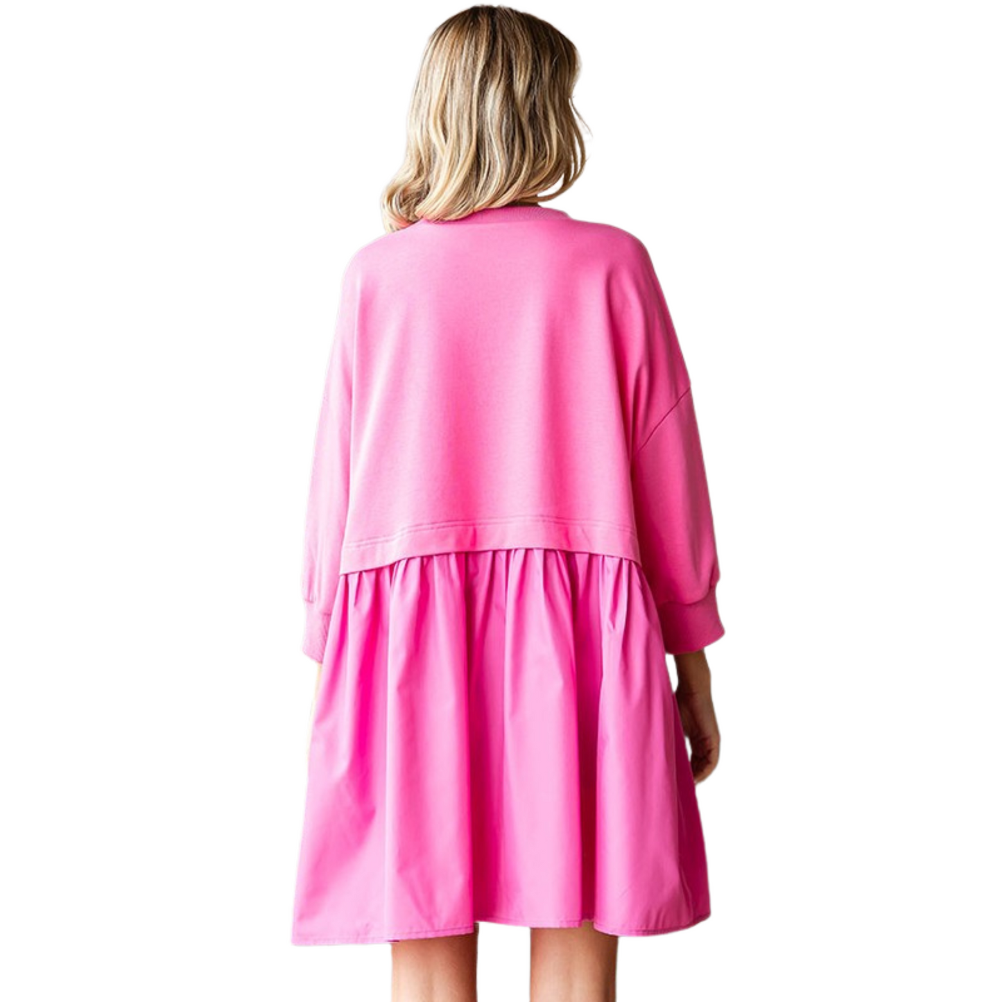 This 3/4 Sleeve Contrast Sweatshirt Dress is the perfect addition to your wardrobe. Made with a solid colored fabric, it features a crew neckline and dropped shoulder banded cuffs, providing maximum comfort and style. The contrasting shirred bottom layer adds a unique touch to this dress. Perfect for any occasion.