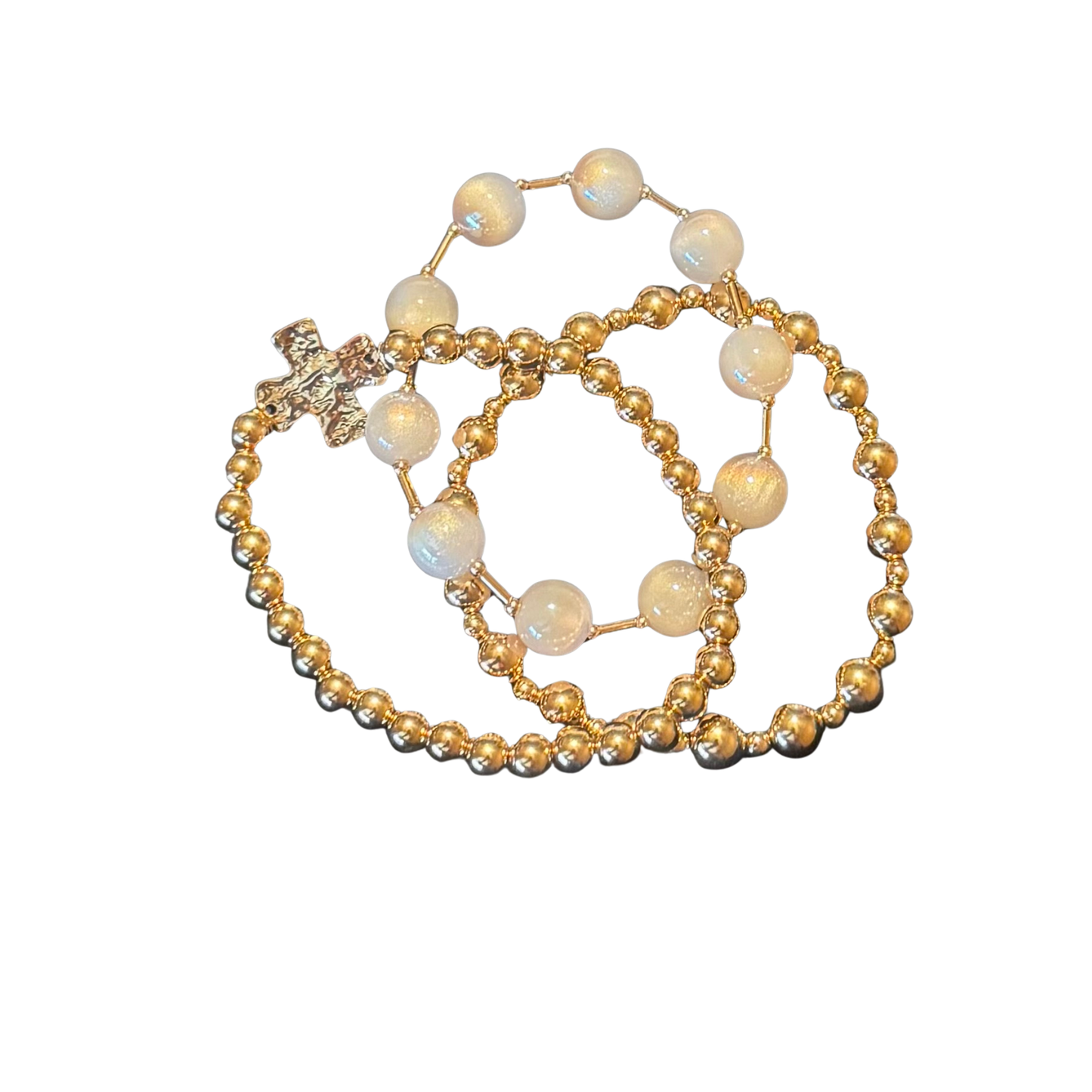 Discover timeless sophistication with this three-piece bracelet collection by ETE Brand. Crafted with precision, each bracelet combines lustrous pearls and intricate beading with warm gold-tone accents, while a meaningful cross detail serves as a spiritual centerpiece. The stretchy construction provides effortless comfort and a customizable fit that adapts to your wrist throughout the day.