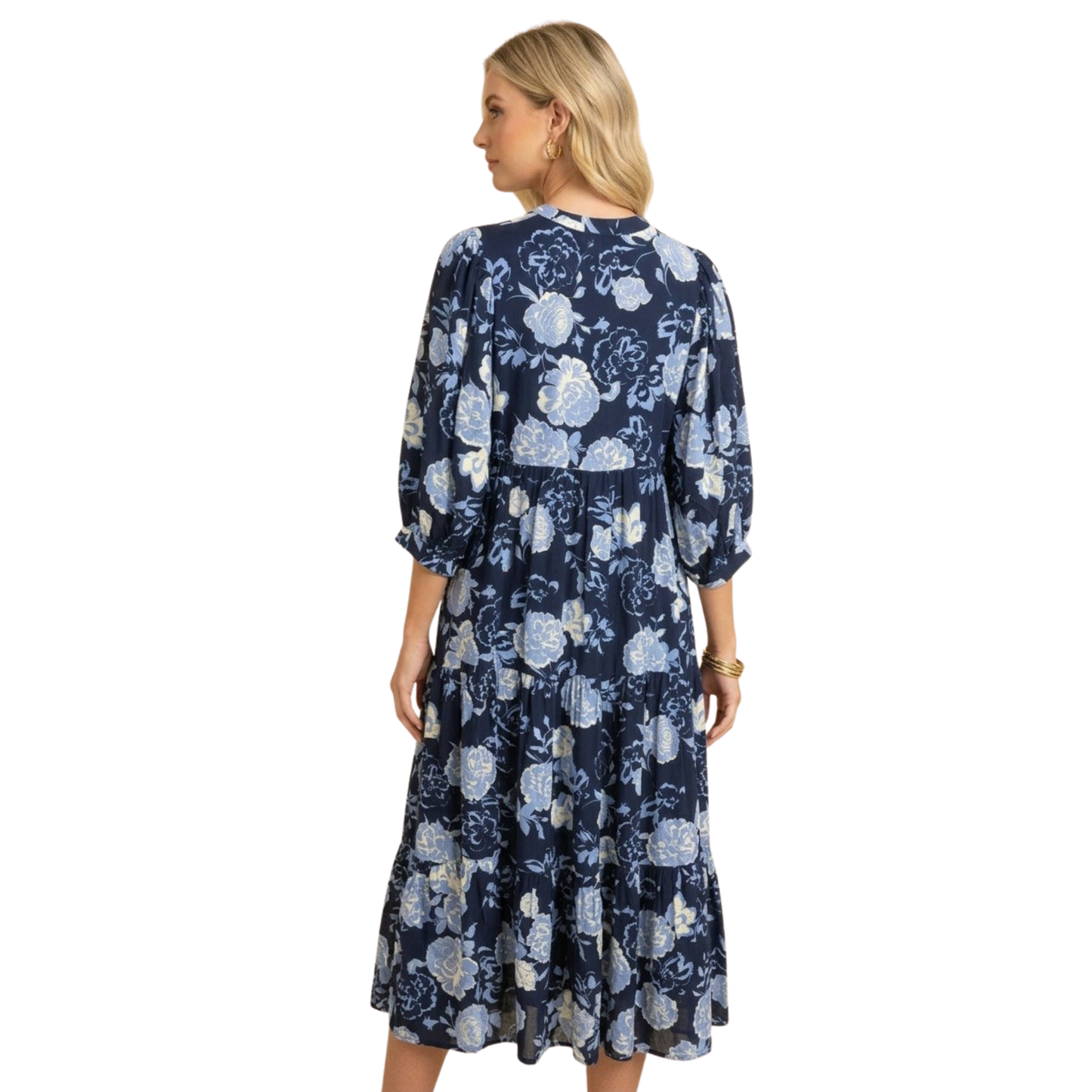 Elegant tiered midi dress in navy with delicate floral print. Features comfortable 3/4 length sleeves and a flattering layered silhouette that moves beautifully. Perfect for casual outings or dressed-up occasions.