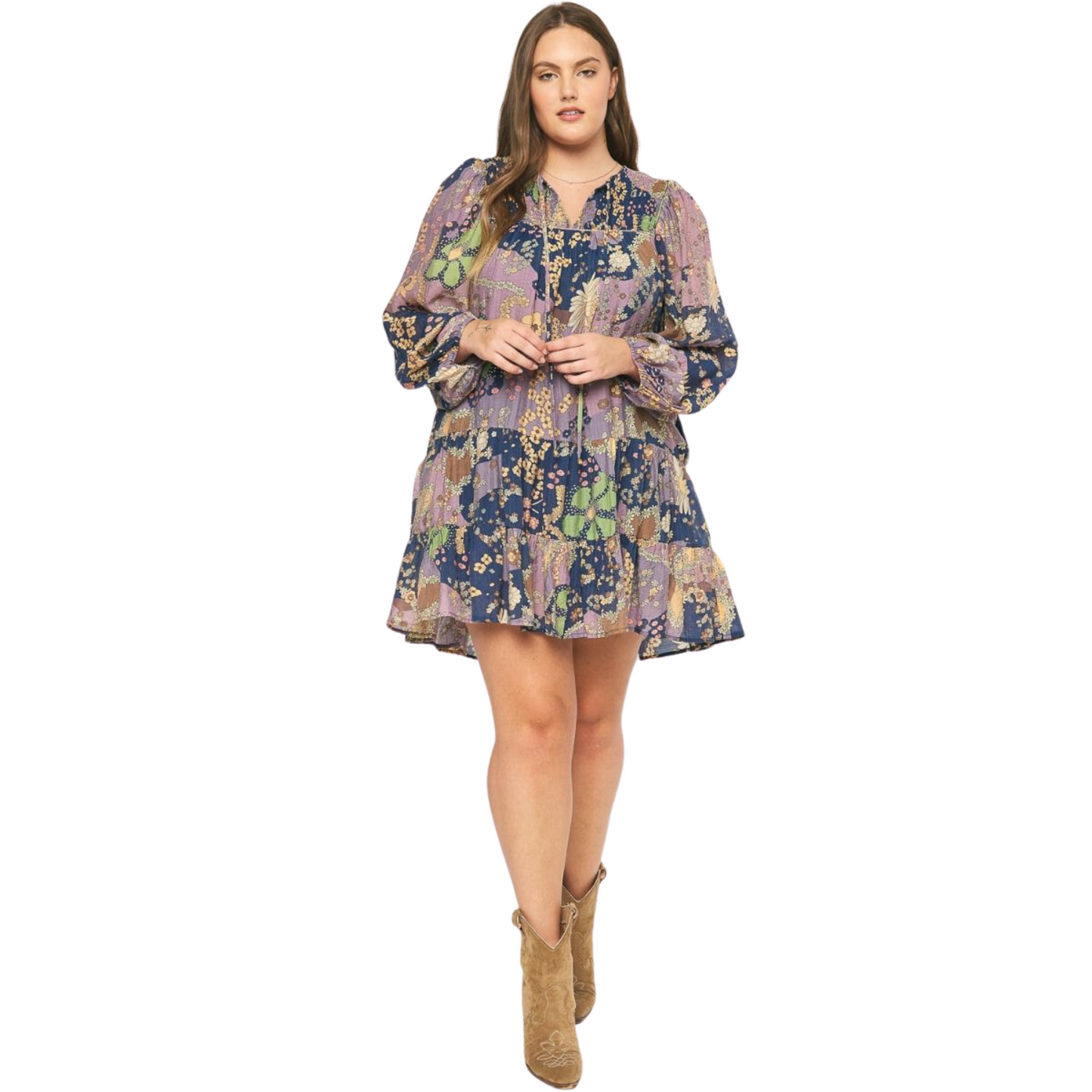 Enjoy effortless style with this beautiful long sleeve tiered mini dress. Crafted from a lightweight fabric featuring a floral print and self-tie detail at the neckline, this mini dress is perfect for any type of occasion. The pockets at the side and tiered hem provide extra convenience and style.